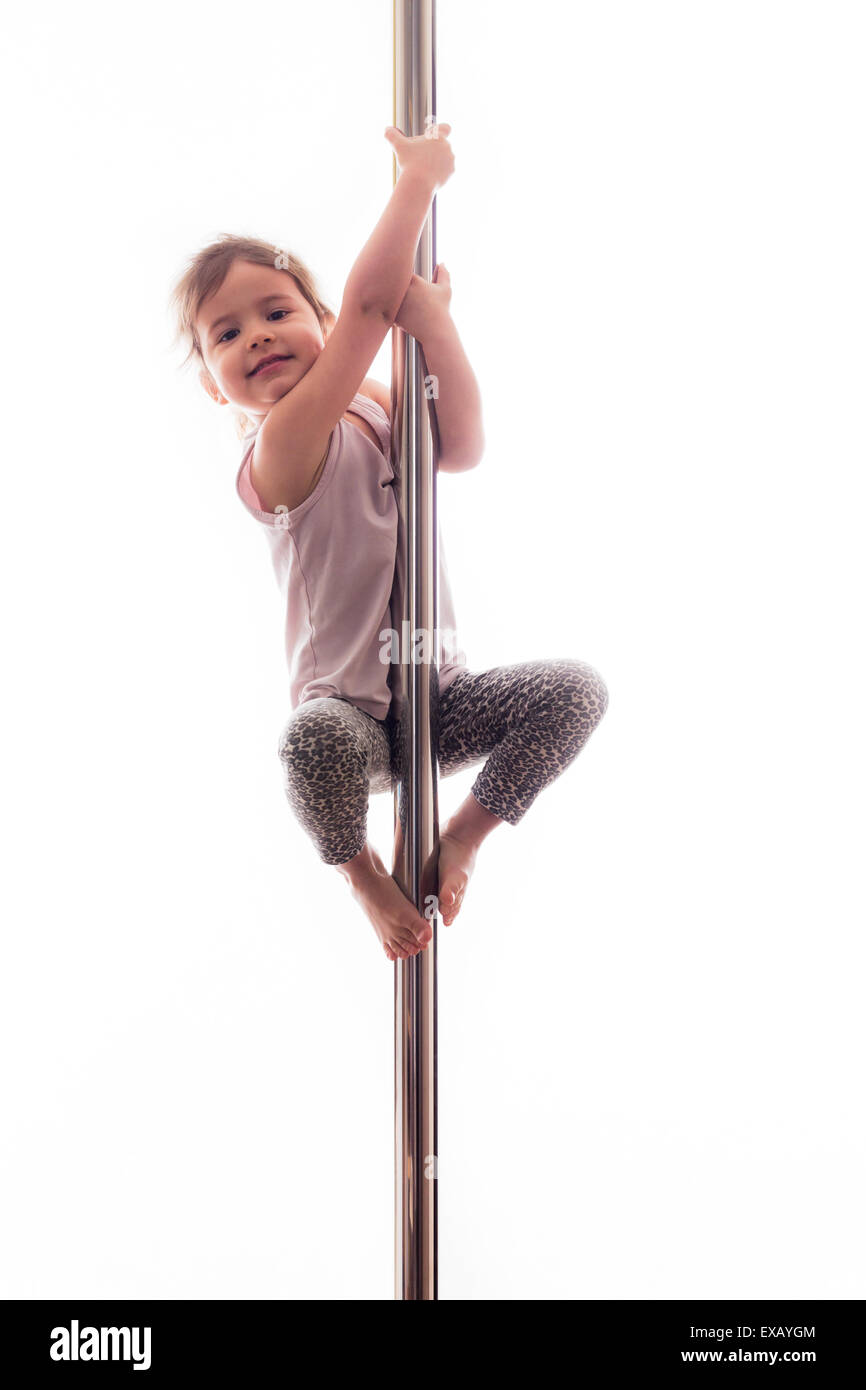 young girl pole dancer Cute little girl on the pole as young pole dancer Stock Photo - Alamy
