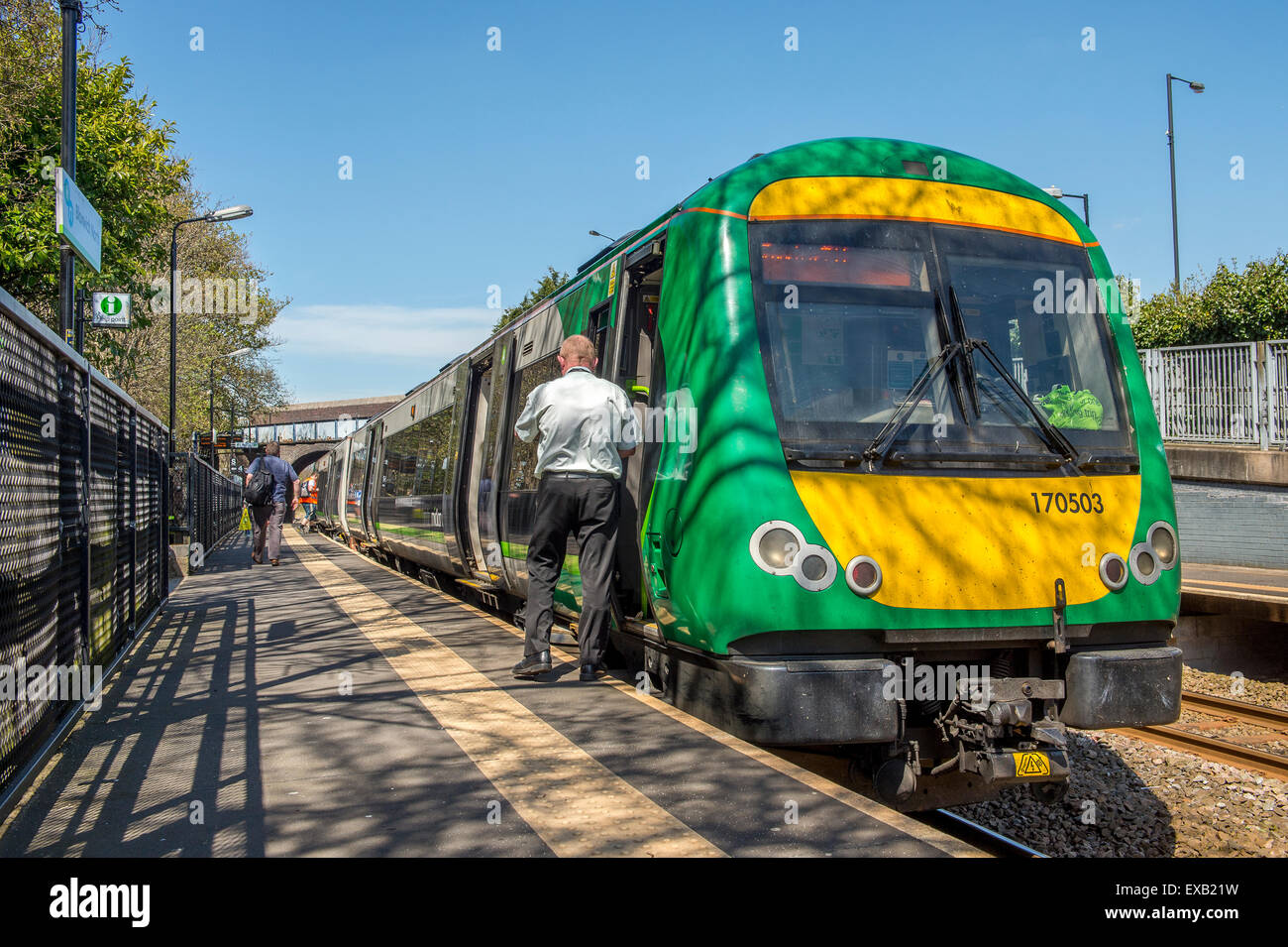 London Midland train waiting at a small branch line station in England. Stock Photo