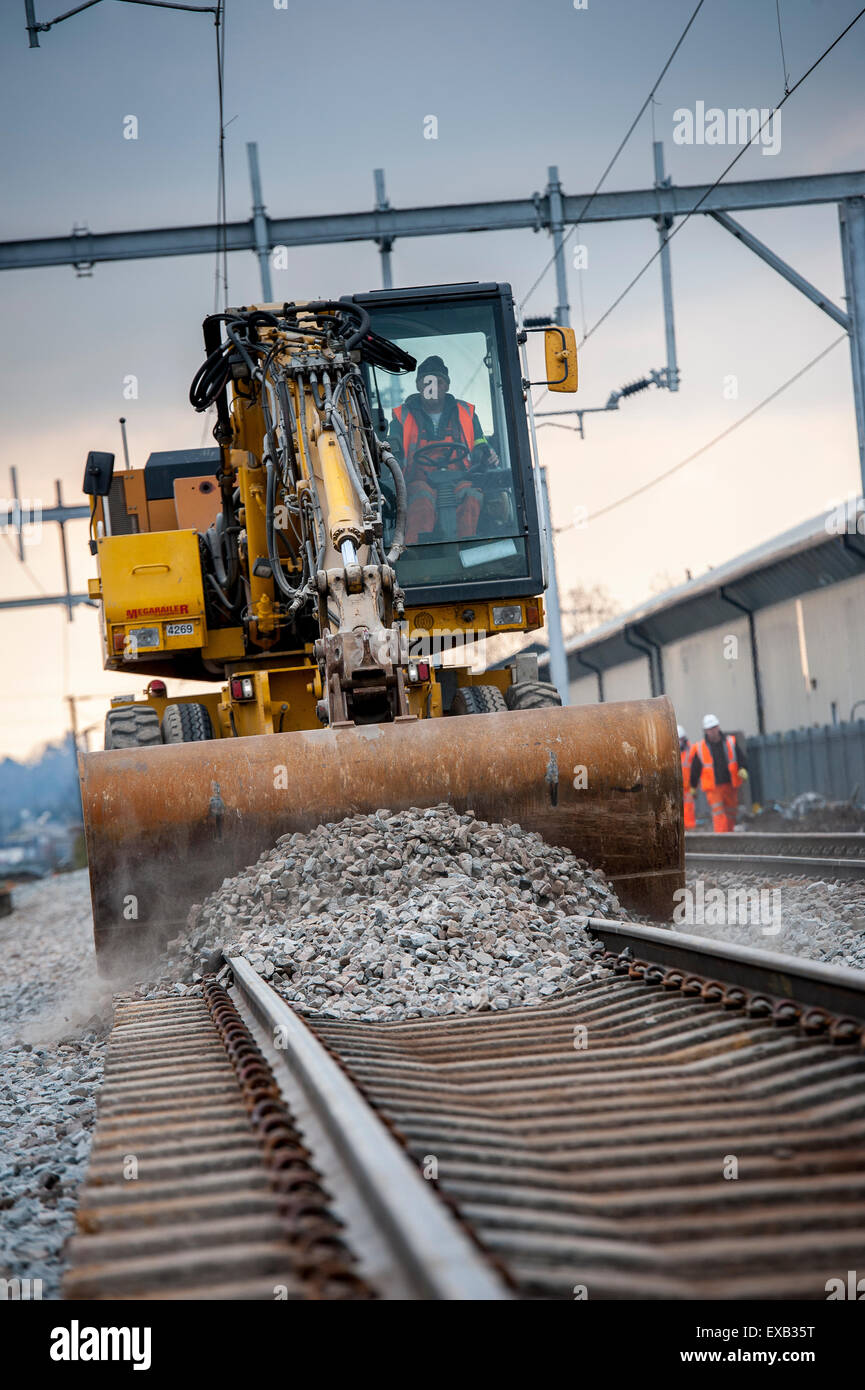 Using a road rail vehicle during maintenance work on a railway truck in the UK. Stock Photo