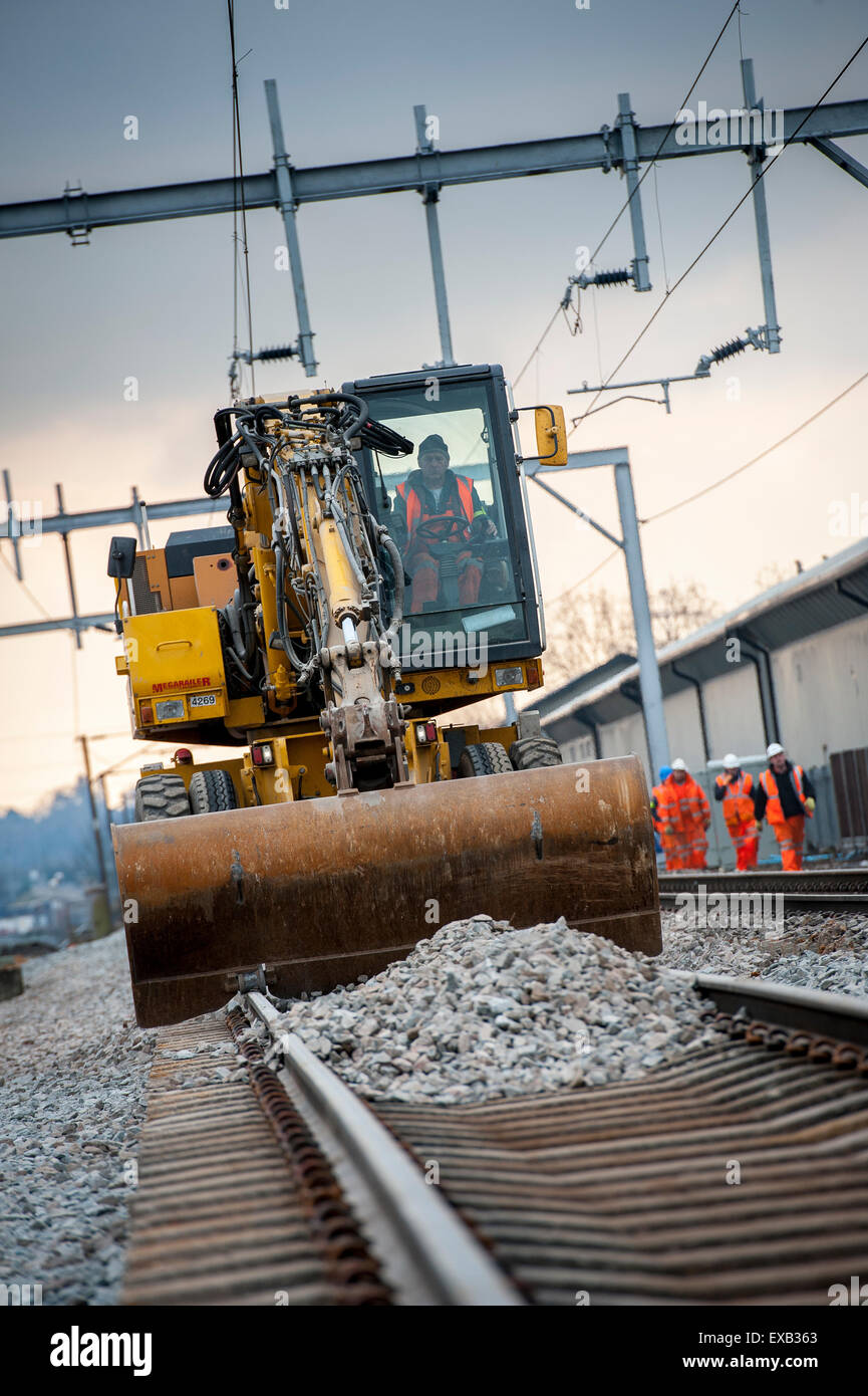 Using a road rail vehicle during maintenance work on a railway truck in the UK. Stock Photo