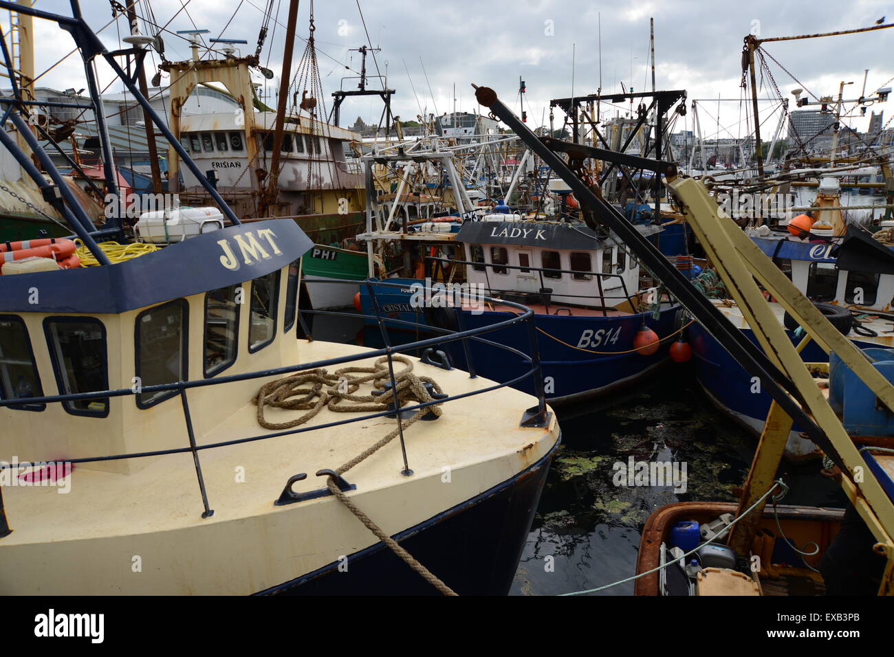 Fishing vessels moored in Sutton Harbour Plymouth including Sunk Scalloper JMT Stock Photo