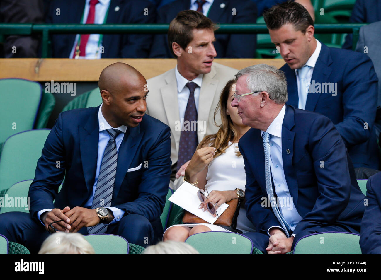 Wimbledon, UK. 10th July, 2015. The Wimbledon Tennis Championships. Gentlemens Singles Semi-Final match between third seed Andy Murray (GBR) and second seed Roger Federer (SUI). Thierry Henry chats to Sir Alex Ferguson in the Royal Box Credit:  Action Plus Sports/Alamy Live News Stock Photo
