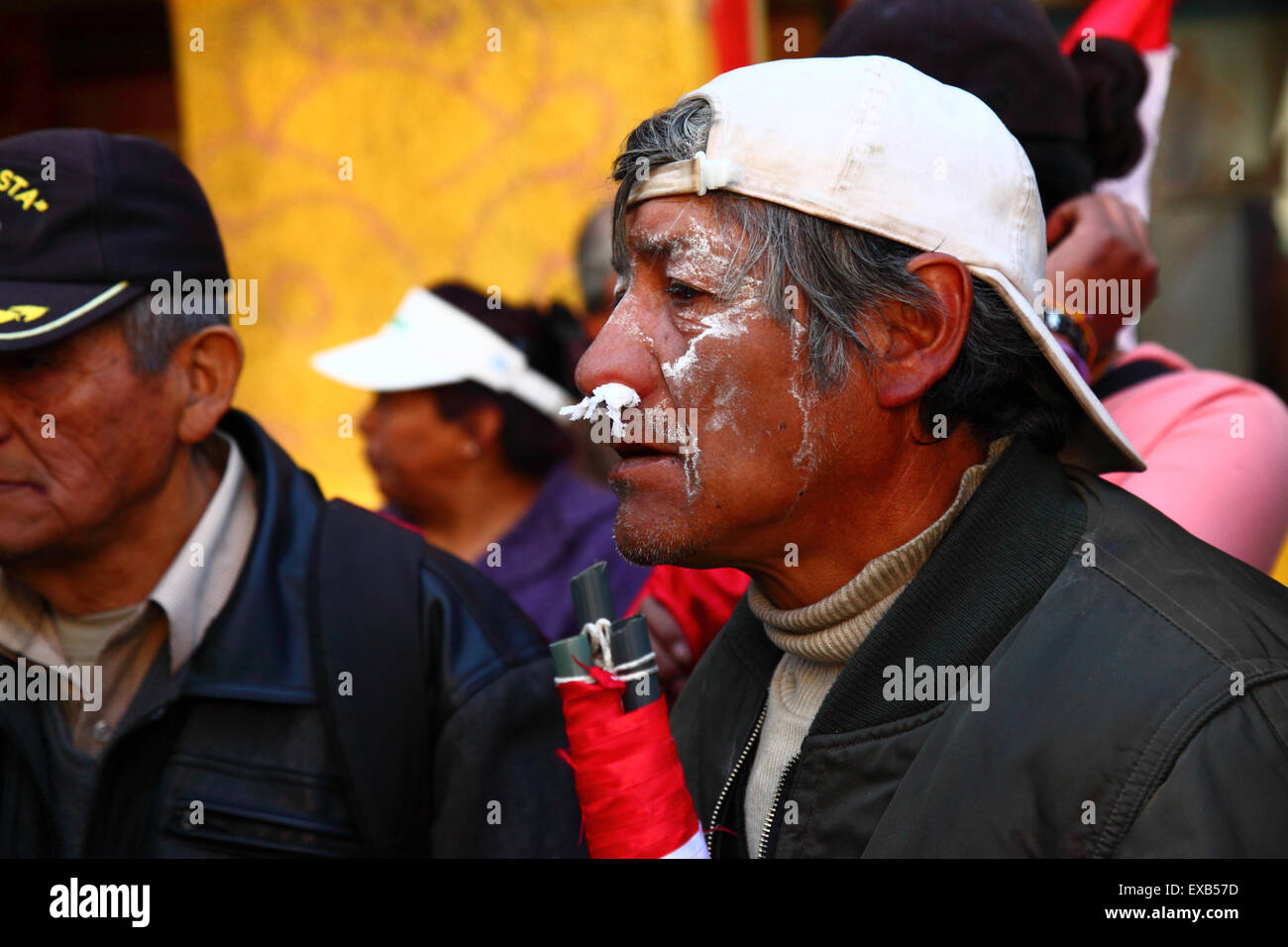 La Paz, Bolivia, 10th July 2015. A protestor from Potosi uses tissue paper in his nostrils to combat the effects of tear gas during a protest by the Potosi Civic Committee and supporters. They are in La Paz to demand the government keeps promises made to the region in the past, which include the construction of a cement factory, hospitals, a hydroelectric plant and an international airport. Police used tear gas to prevent the protesters entering Plaza Murillo (where the Presidential Palace and Congress buildings are) Credit:  James Brunker/Alamy Live News Stock Photo