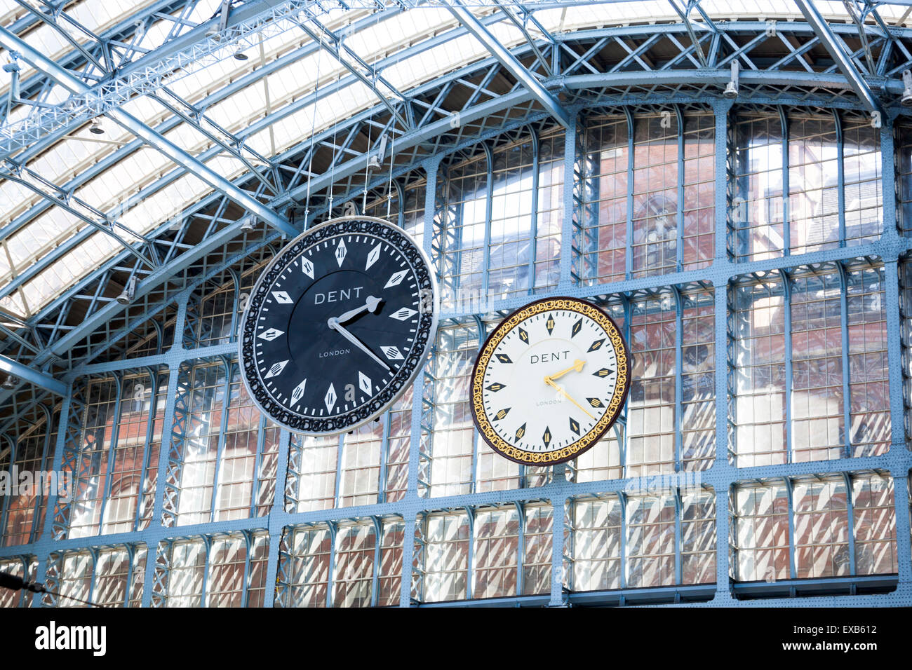 London July 2015 - The dent clock at St Pancras International with it's exact replica in black by British artist Cornelia Parker Stock Photo