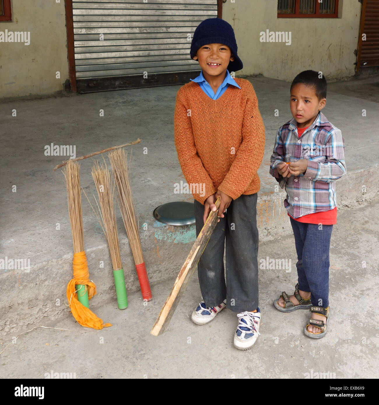 young boys playing cricket in a village in the Indian Himalayas - Spiti Valley, Himachal Pradesh, India. Stock Photo