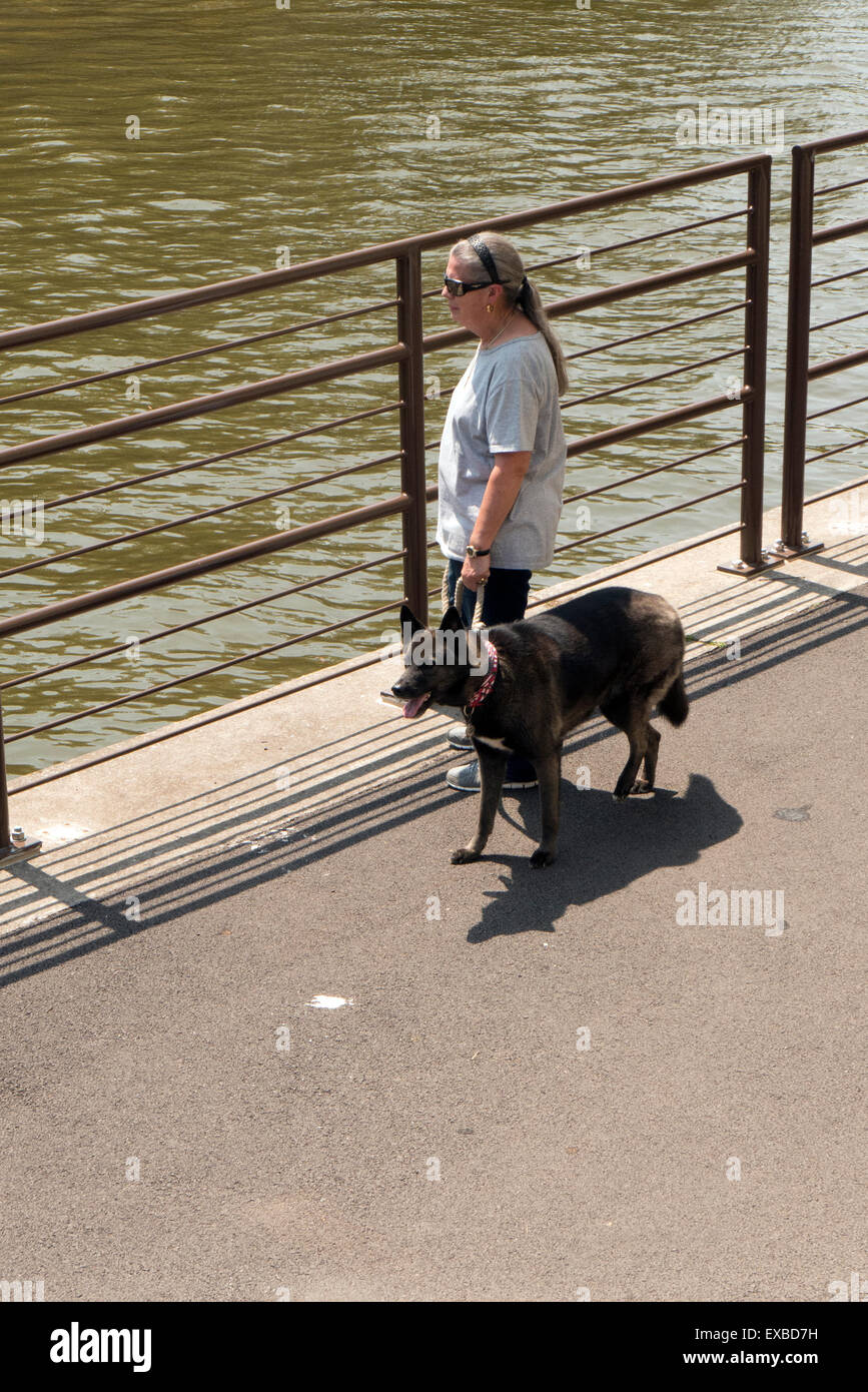 Woman with dog at Erie Canal. Stock Photo