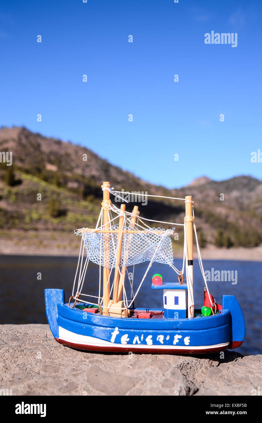 Blue Fishing Boat Figurine Stock Photo - Alamy