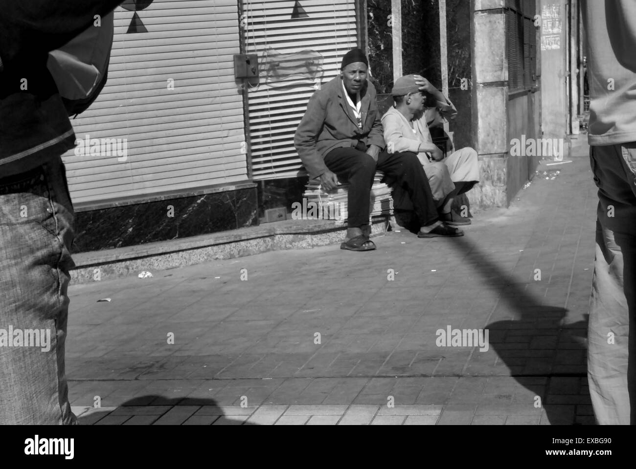 Two arab men sitting in Cairo street Stock Photo