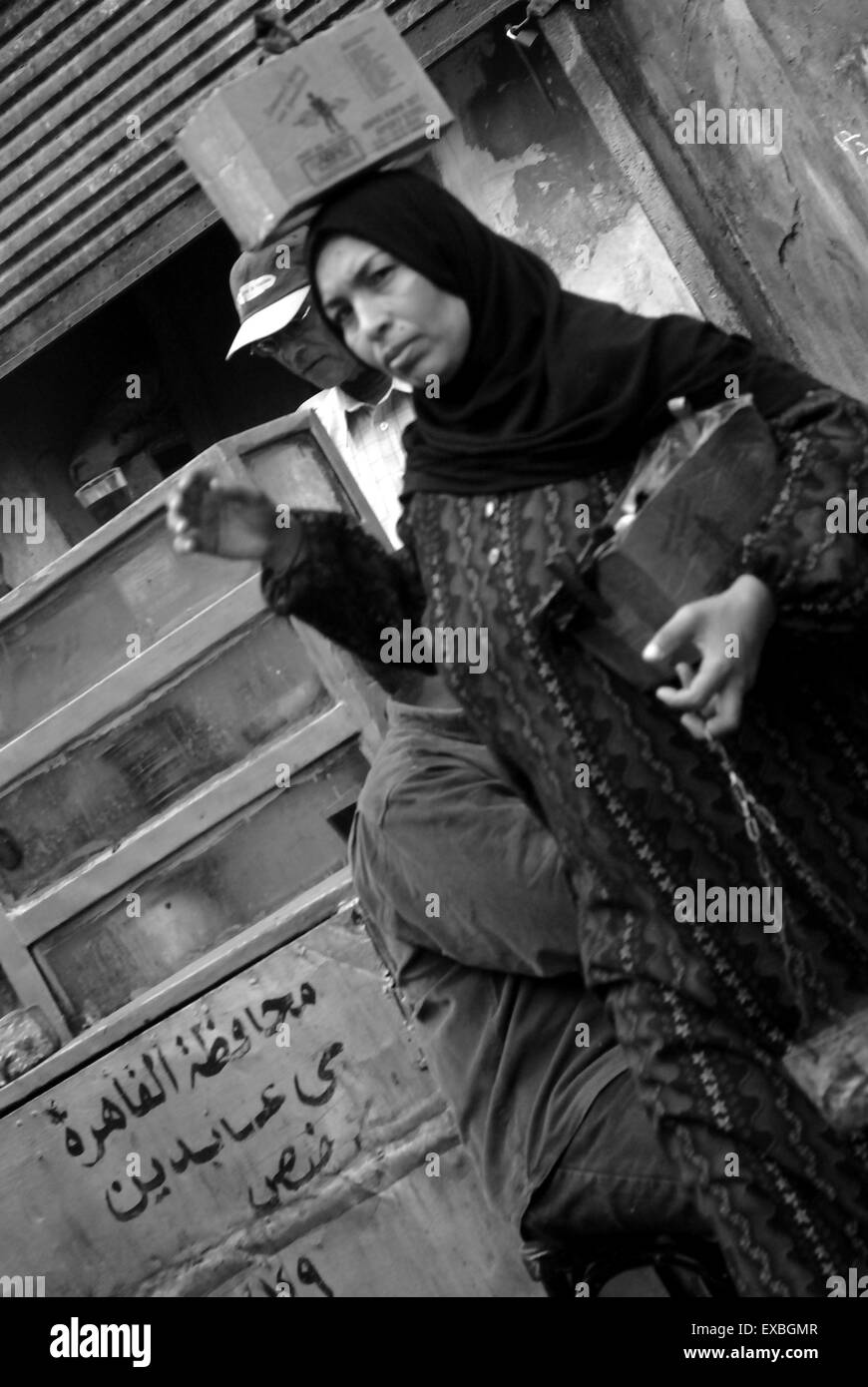 Woman carrying box on her head, Cairo, Cairo, Egypt Stock Photo