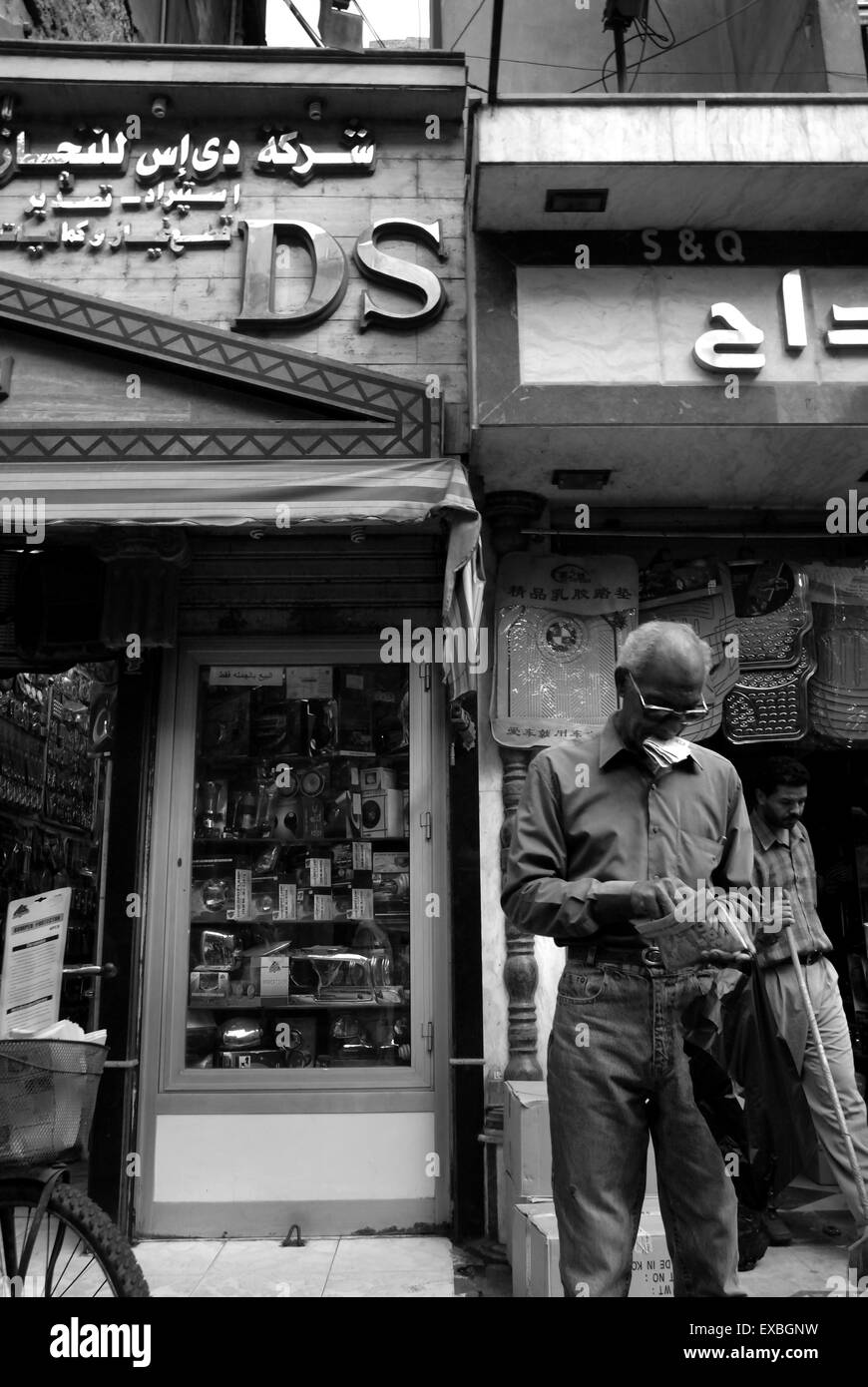 Arab man counting money in Cairo street Stock Photo