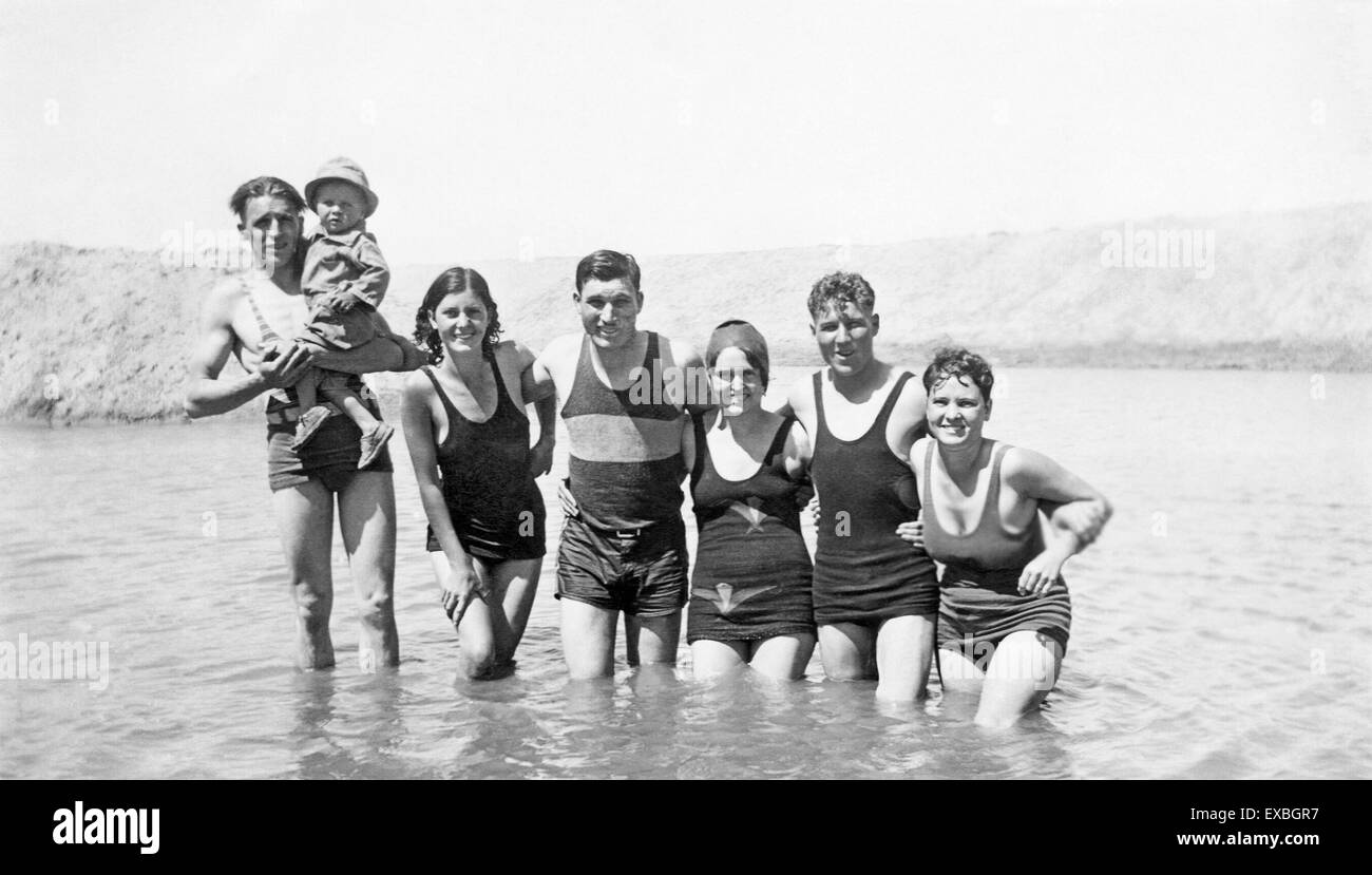A group of young caucasian people from Belen, New Mexico, swimming in Elephant Butte lake in in southern New Mexico near the town of Truth or Consequences in 1930. At the time, the town was named Hot Springs, New Mexico. Stock Photo
