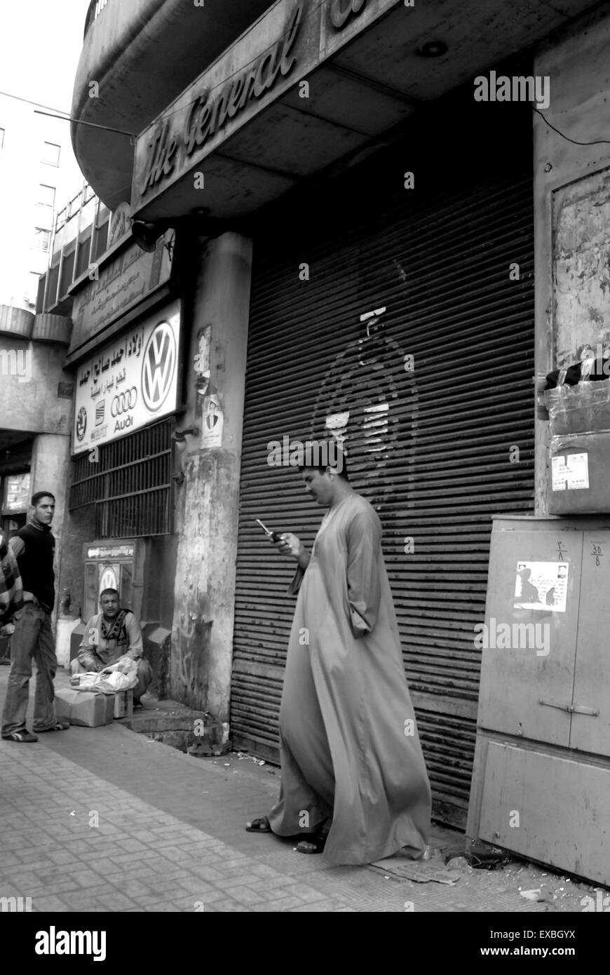 Man texting on Cairo street Stock Photo