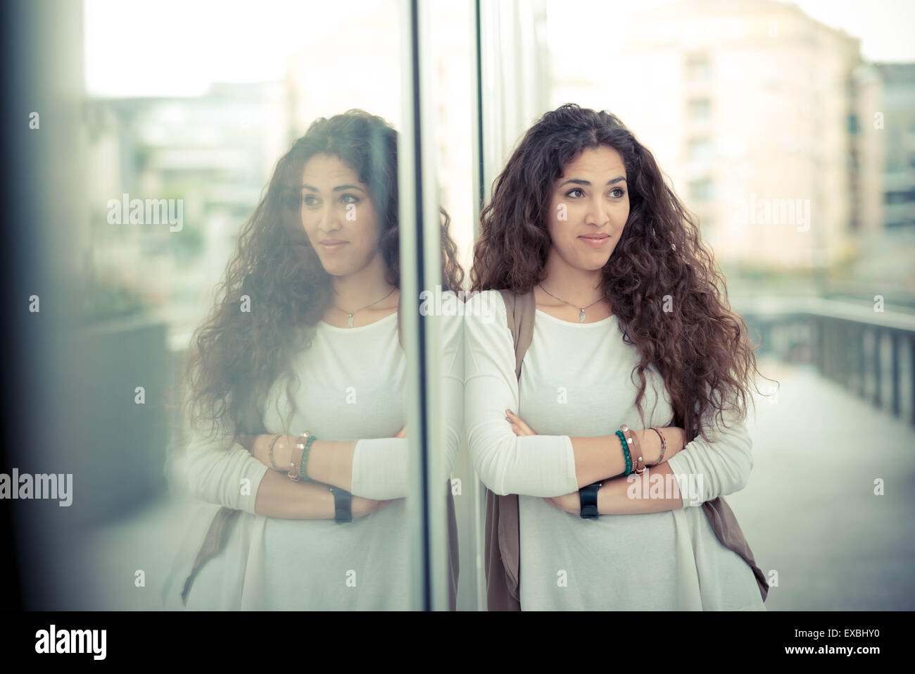 beautiful curly long hair moroccan woman in the city Stock