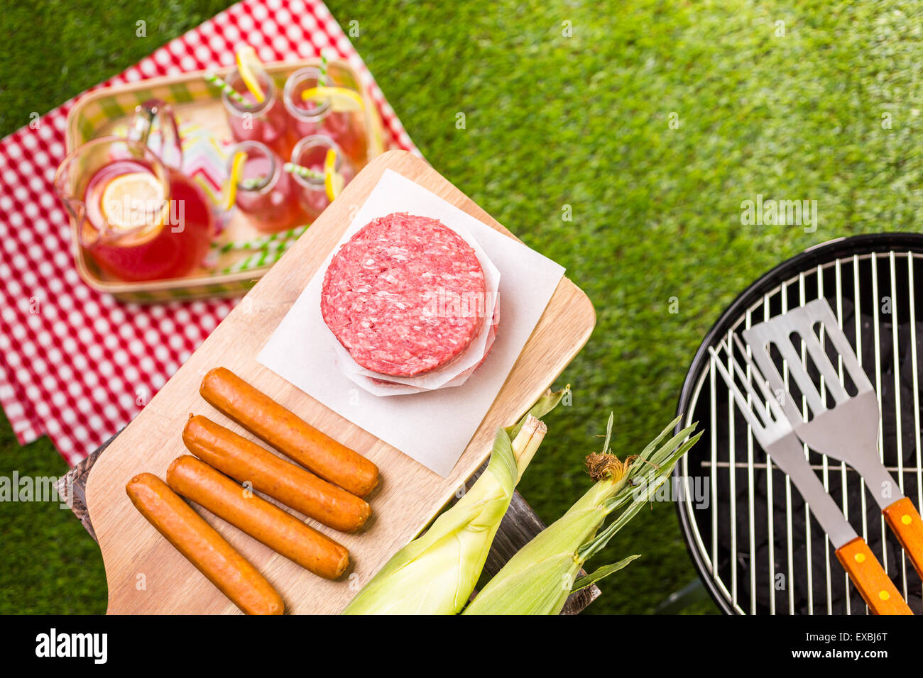 Summer picnic with small charcoal grill in the park Stock Photo Alamy