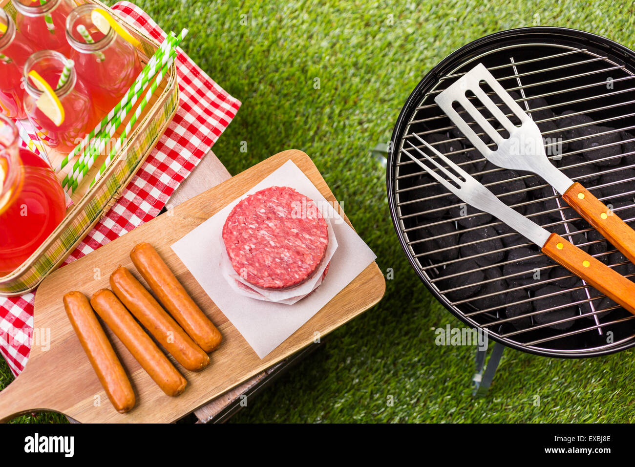 Summer picnic with small charcoal grill in the park Stock Photo Alamy