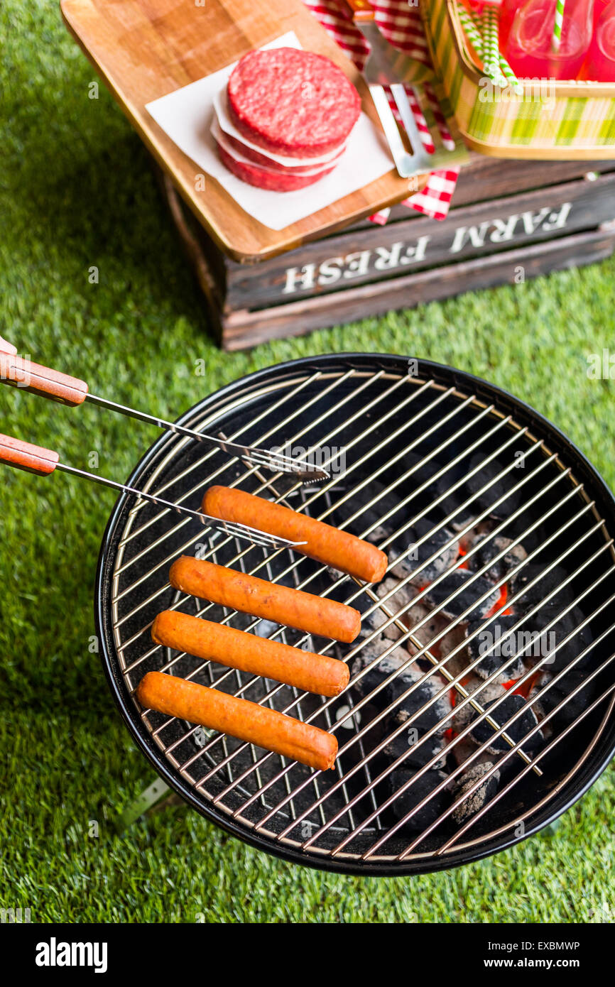Summer picnic with small charcoal grill in the park Stock Photo Alamy