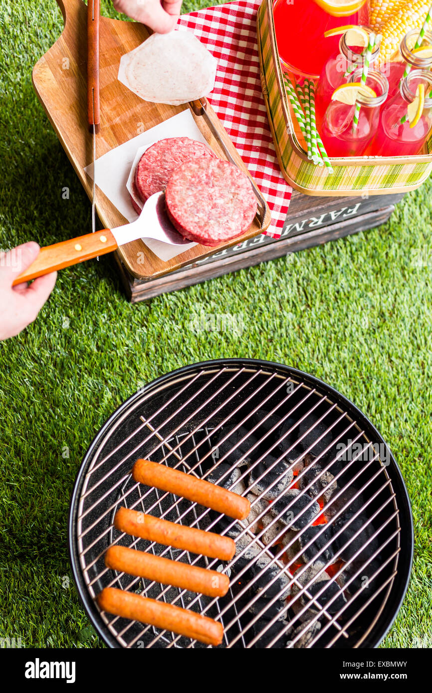 Summer picnic with small charcoal grill in the park Stock Photo Alamy