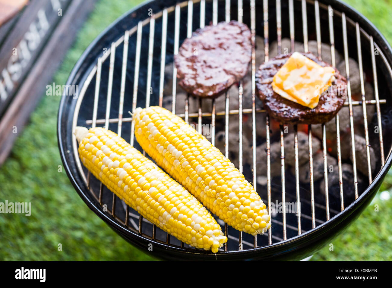 Summer picnic with small charcoal grill in the park Stock Photo Alamy