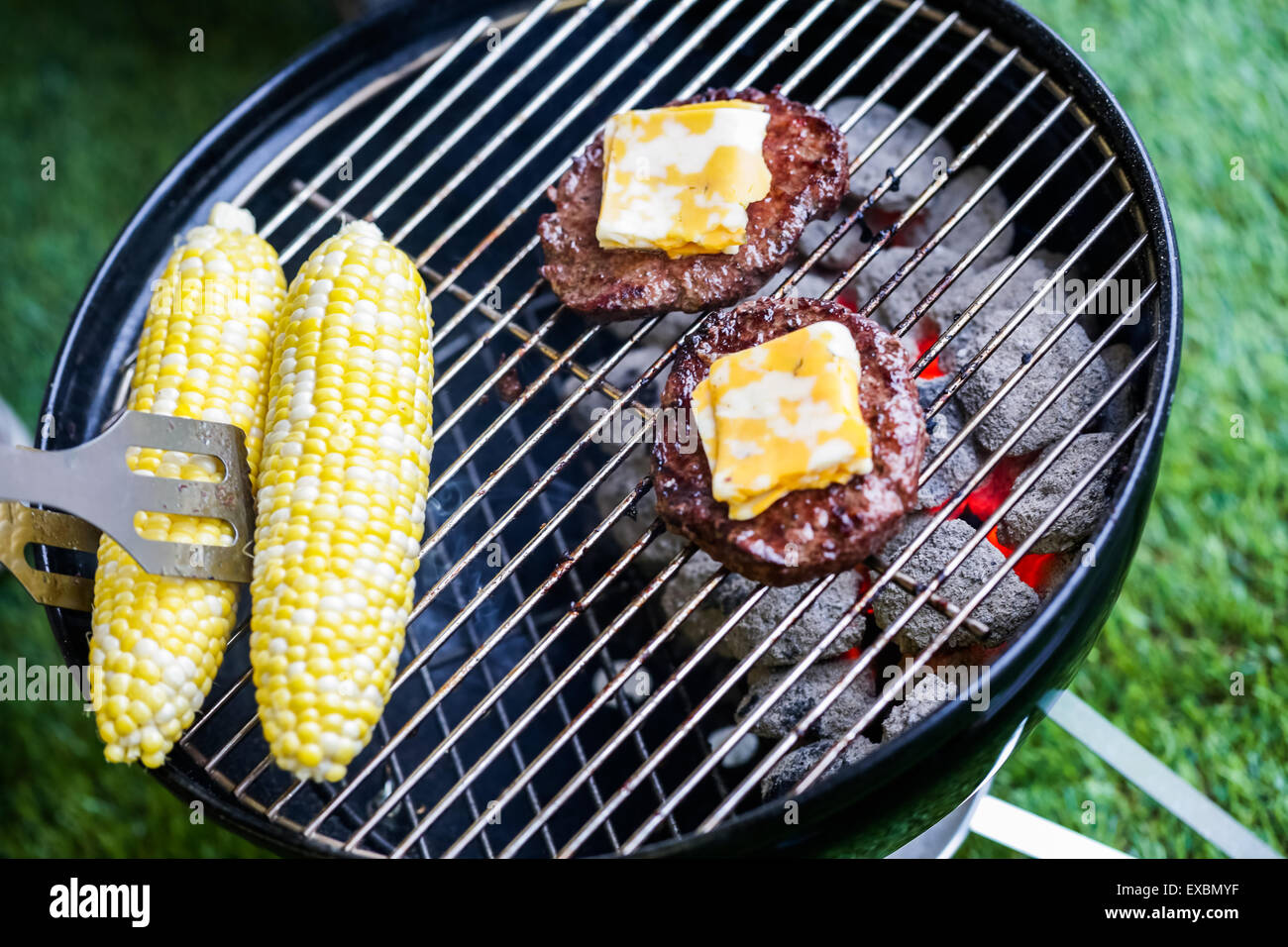 Summer picnic with small charcoal grill in the park Stock Photo Alamy