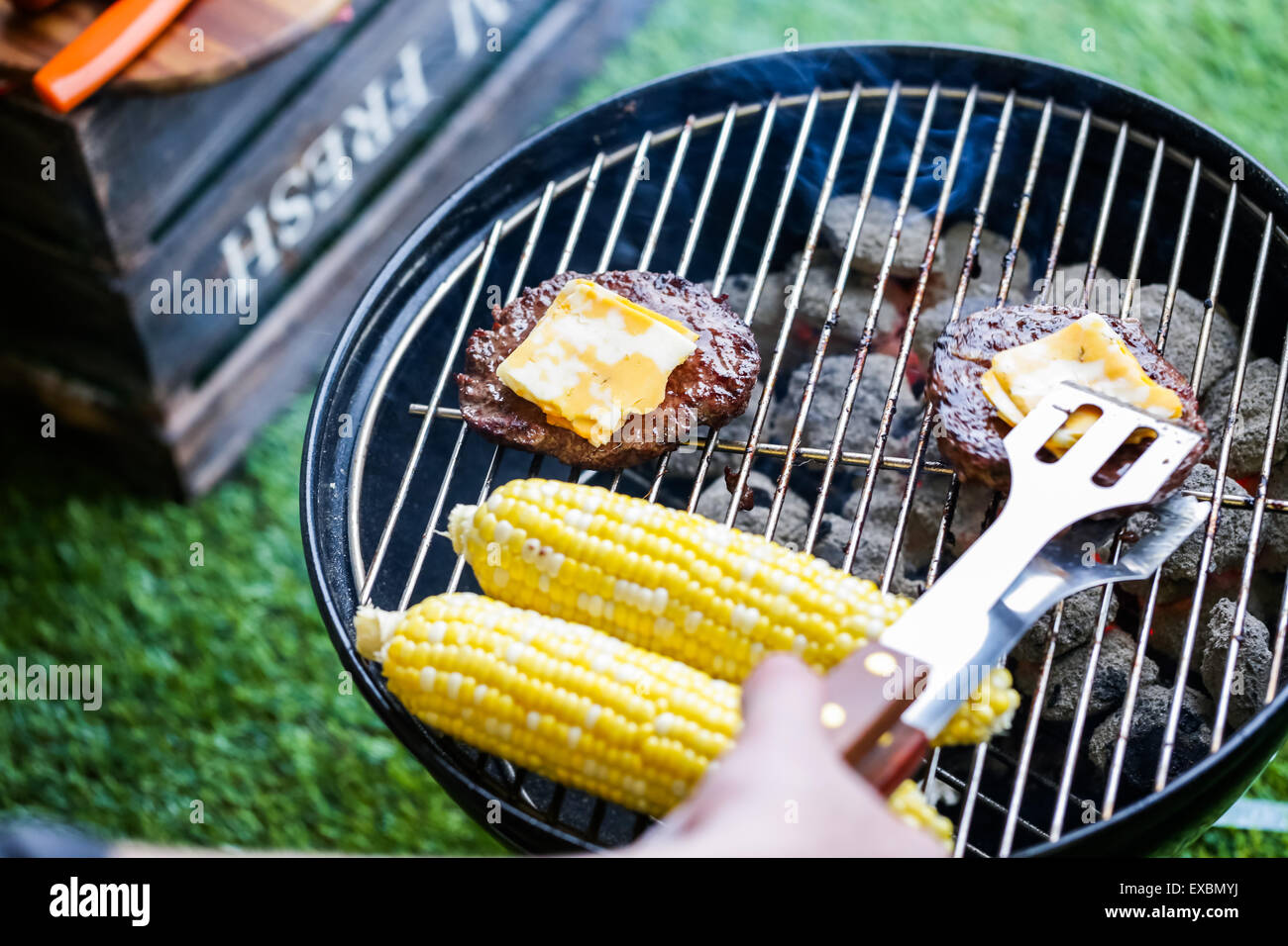 Summer picnic with small charcoal grill in the park Stock Photo Alamy
