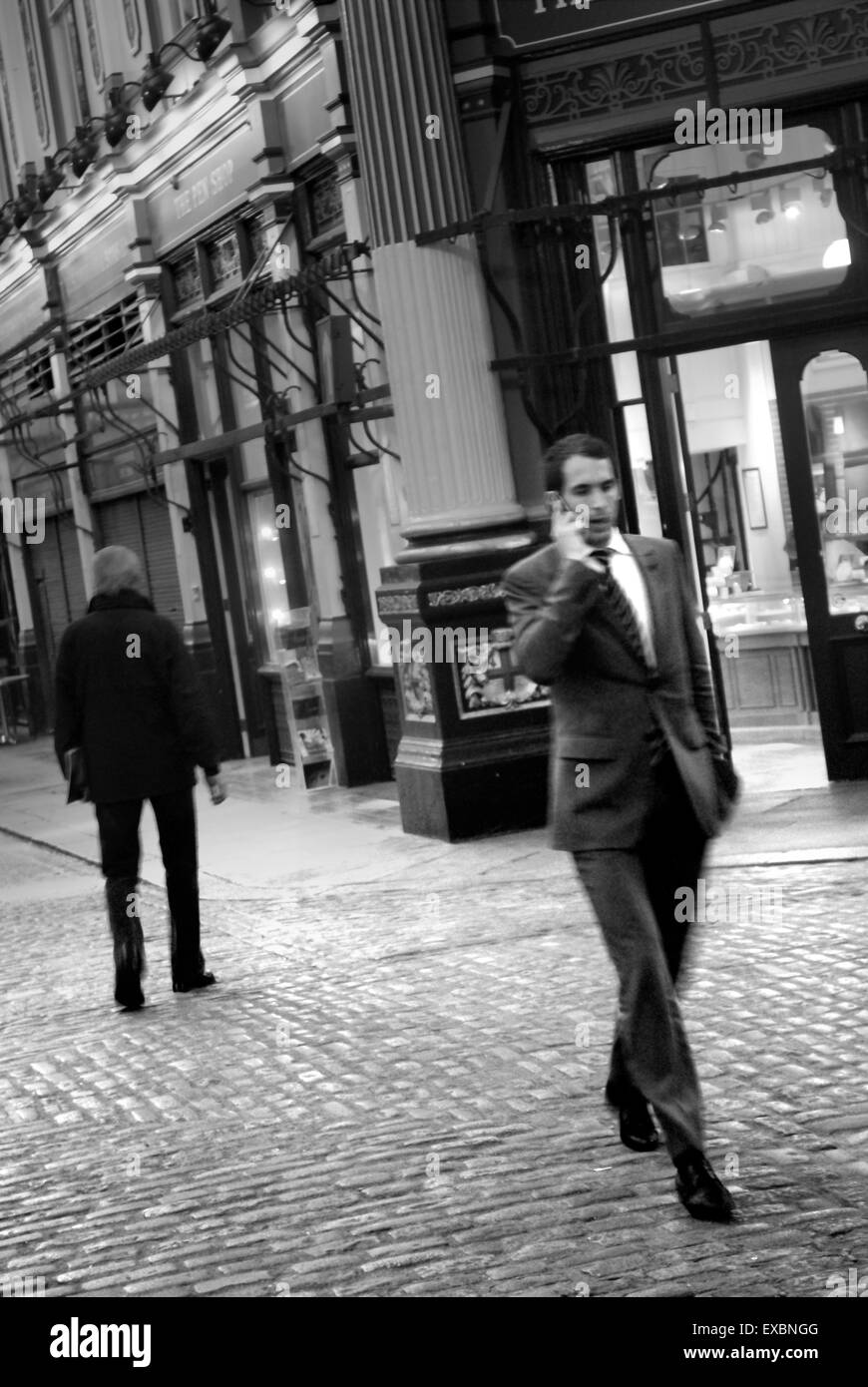Banker walking through Leadenhall Market, The City of London Stock Photo