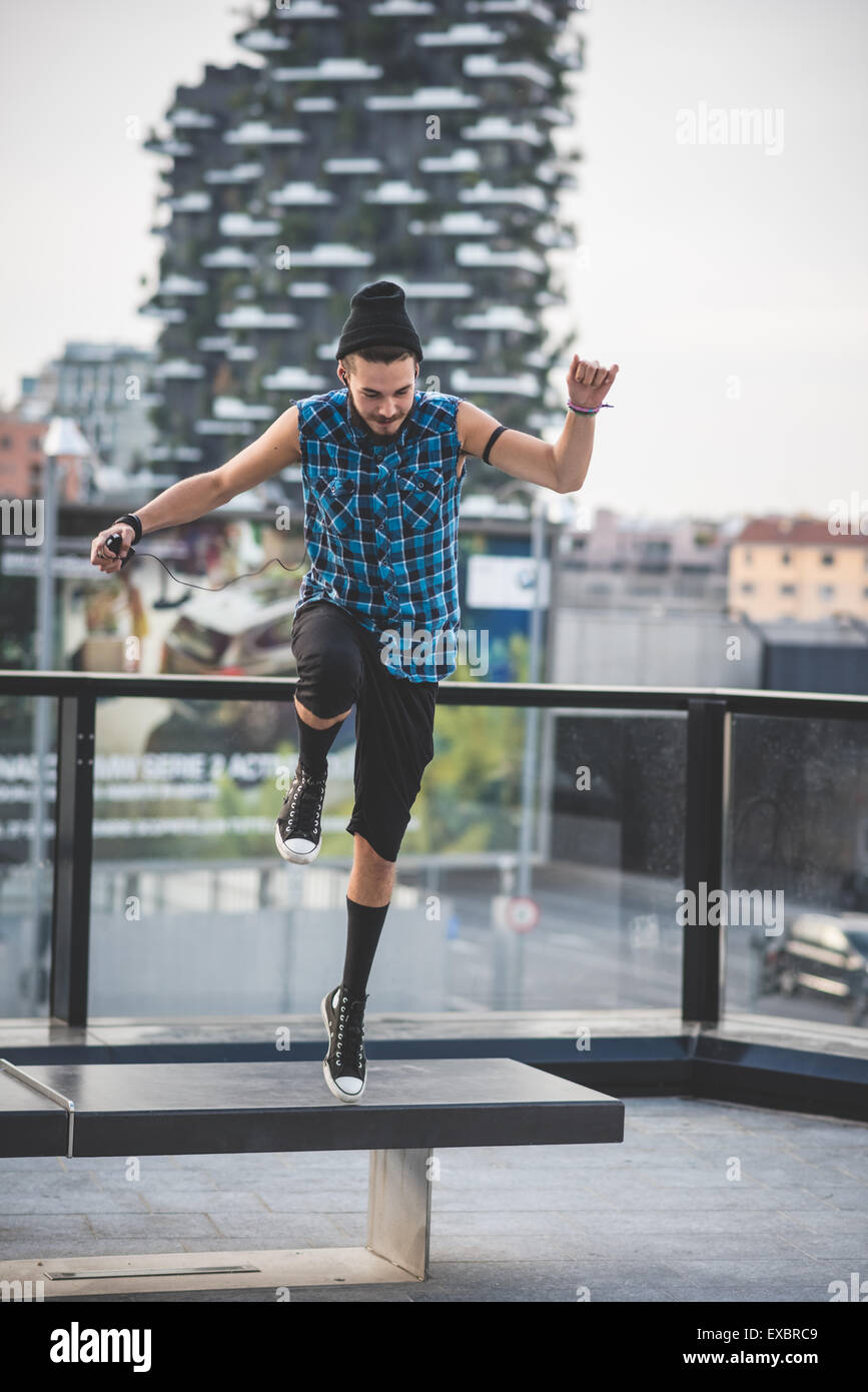 young handsome bearded hipster man in the city Stock Photo - Alamy