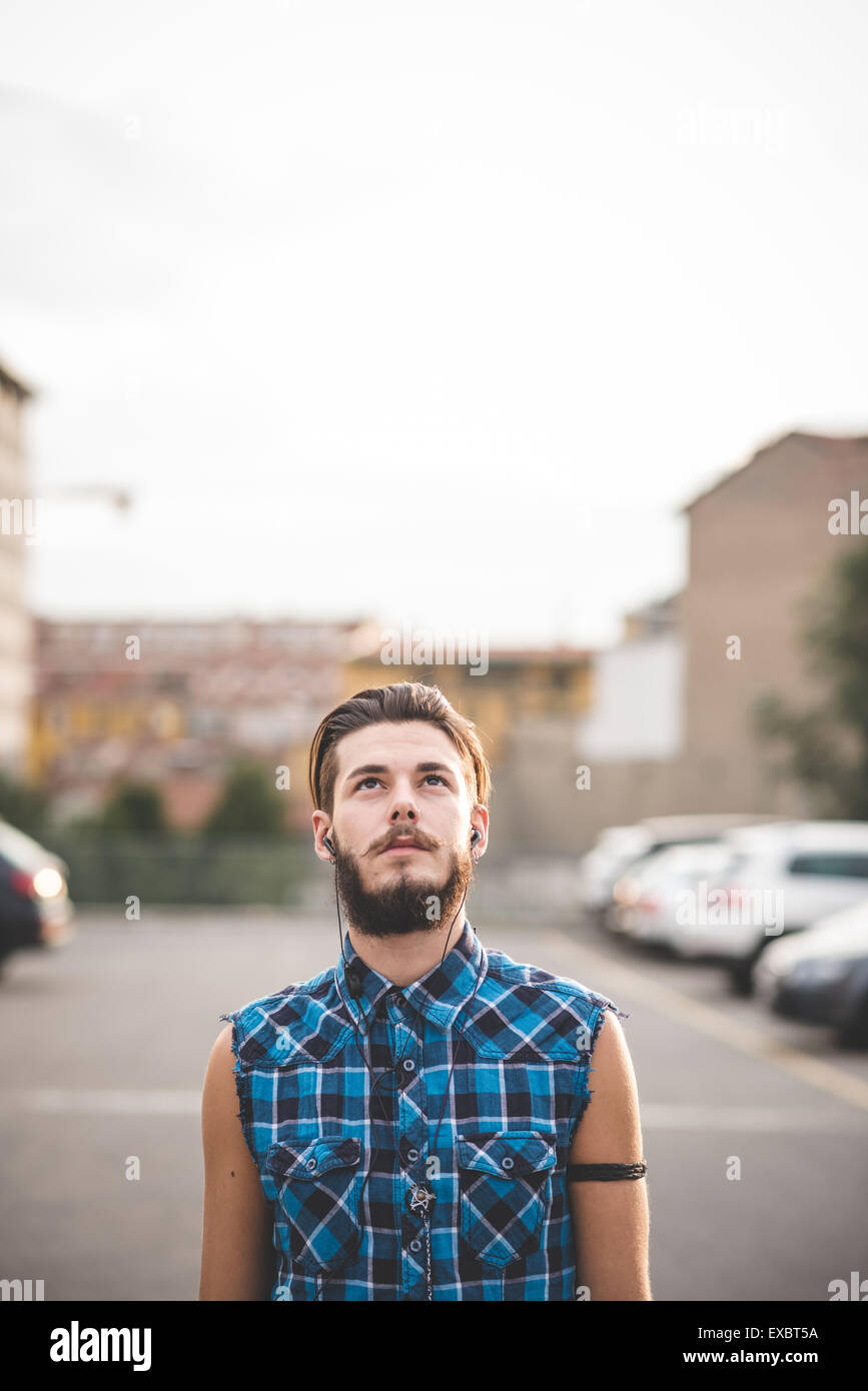 young handsome bearded hipster man in the city Stock Photo - Alamy