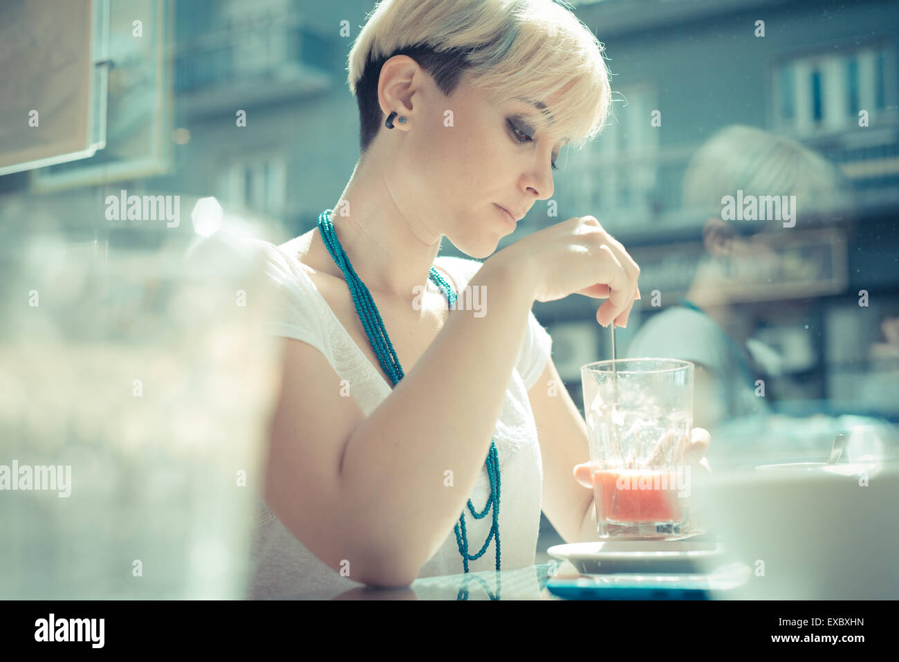 Beautiful Young Blonde Short Hair Hipster Woman At The Cafe Stock