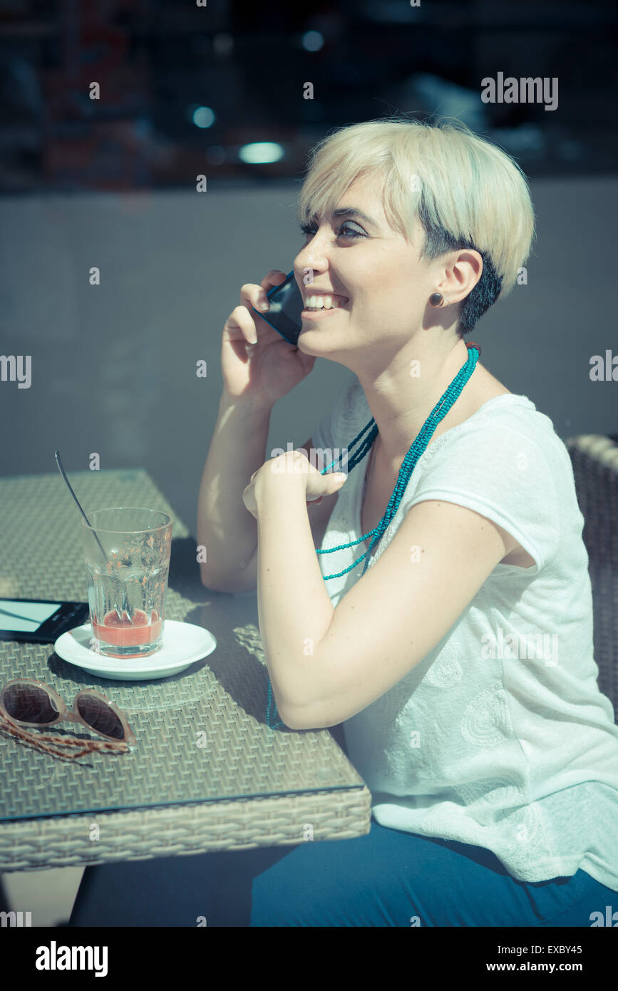 Beautiful Young Blonde Short Hair Hipster Woman At The Cafe Stock