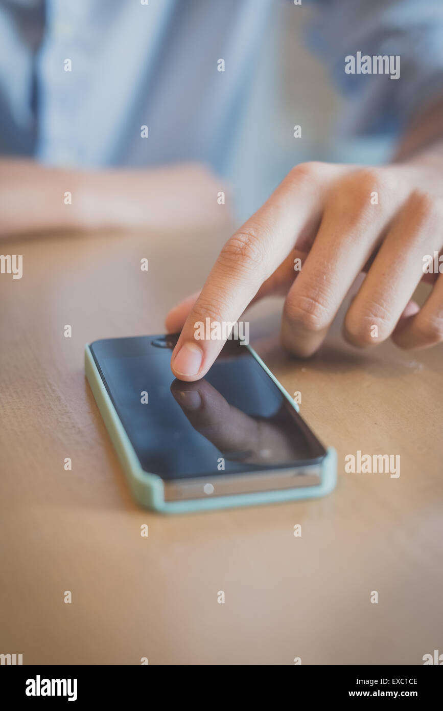 close up man hand using smartphone at the bar Stock Photo - Alamy