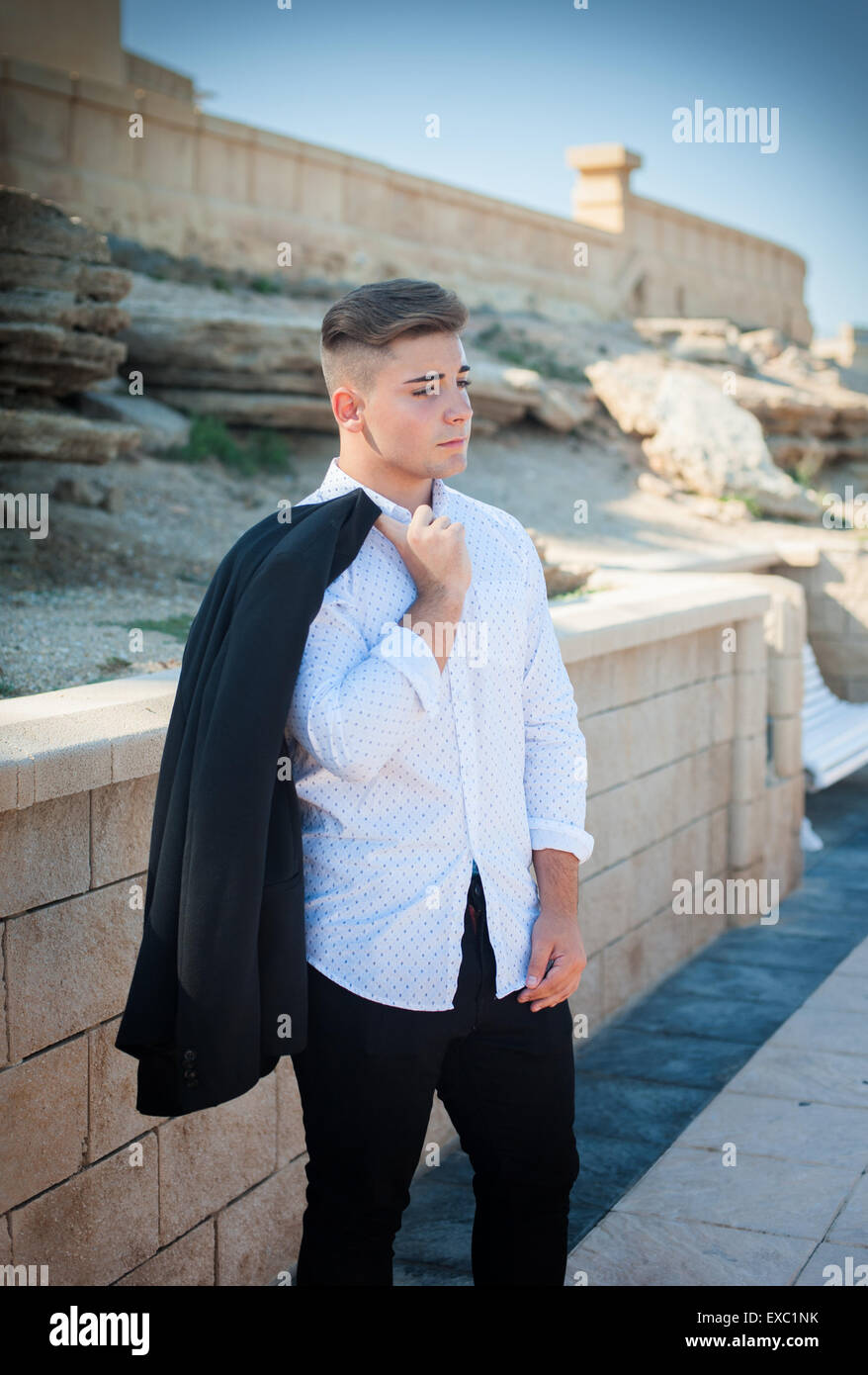 Photo handsome guy in a shirt on a background of nature Stock Photo