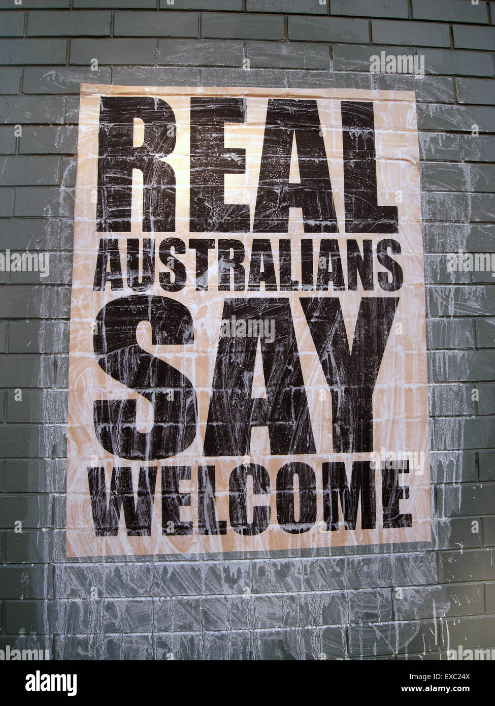 Perth, Australia. 11th July, 2015. As a nation built on immigration and multiculturalism, not all Australians support their government's hardline stance against asylum seekers: grass-roots campaigns are cropping up all over the country advocating for a more humanitarian approach to refugees. REAL AUSTRALIANS SAY WELCOME posters recently originated in Melbourne, Victoria, but are now starting to appear on city walls 3500km away in Perth, Western Australia (pictured). Credit:  Suzanne Long/Alamy Live News Stock Photo