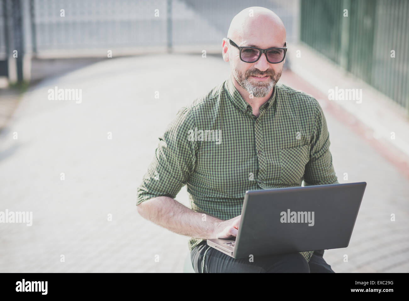 Mature bald bearded man using hi-res stock photography and images - Alamy