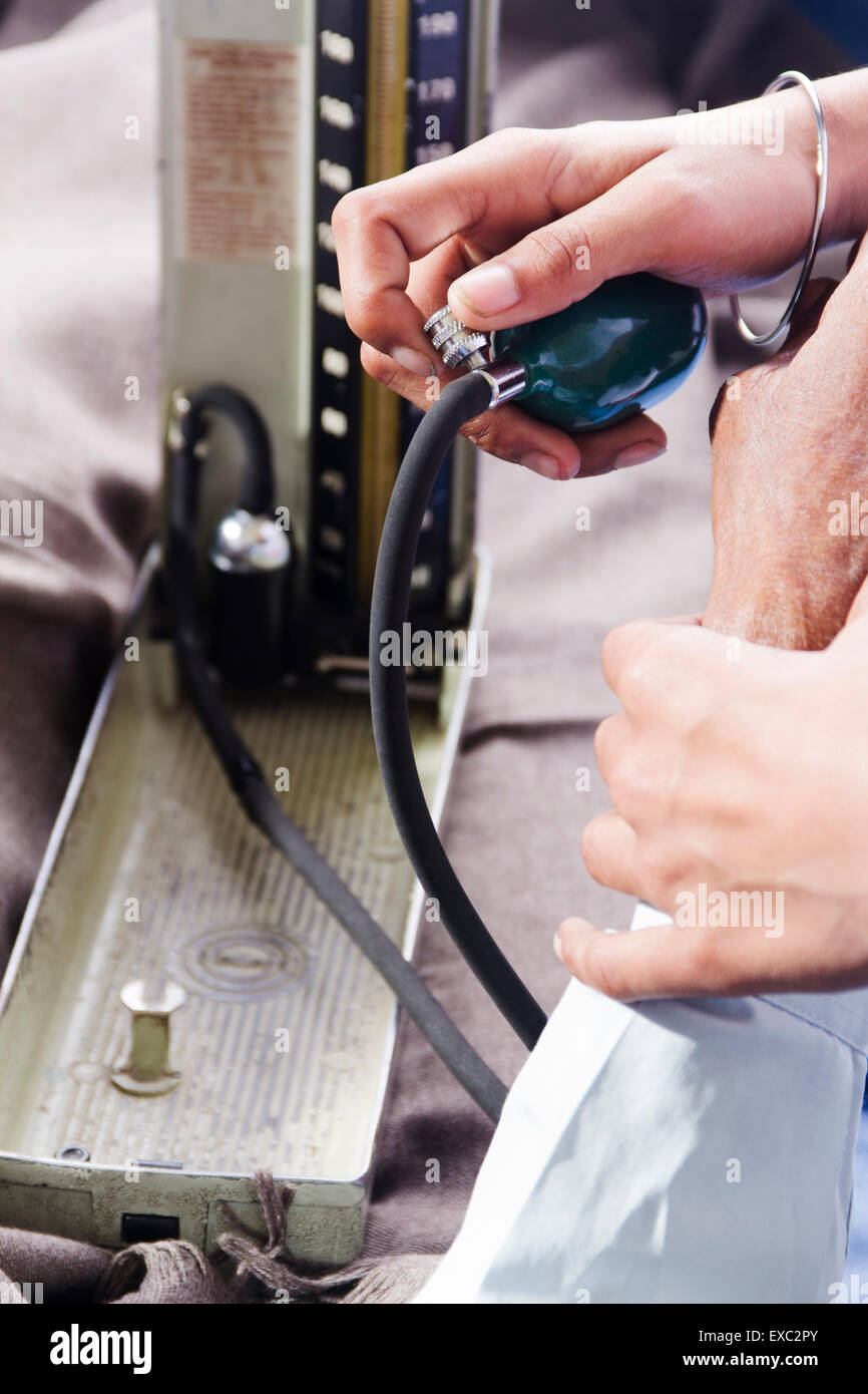 doctor hospital Patient Blood Pressure Checking Stock Photo