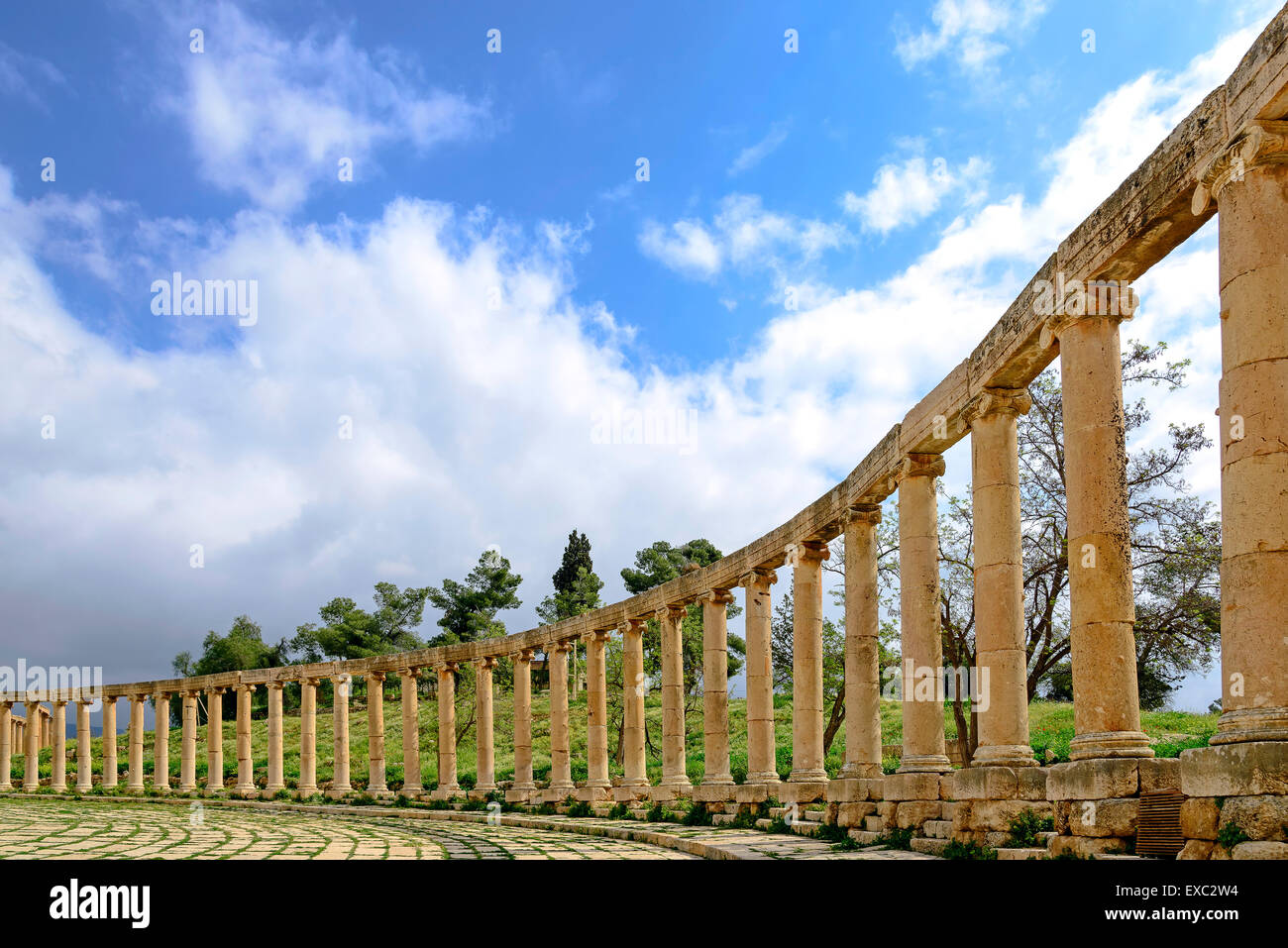 View of the Oval Forum colonnade in ancient Jerash, Jordan - Jerash is the site of the ruins of the Greco-Roman city of Gerasa. Stock Photo