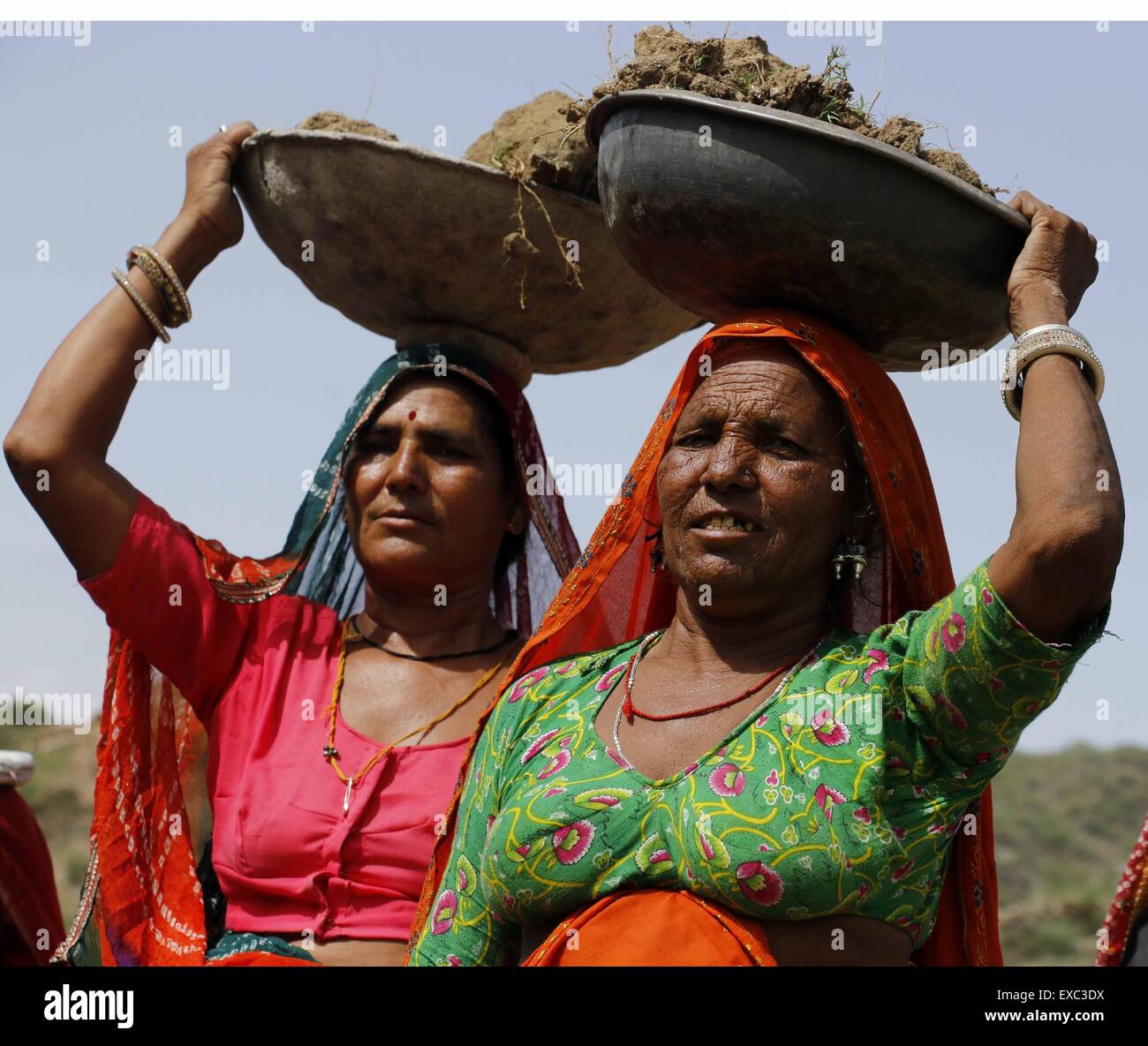 Villagers work on a NREGA (National Rural Employment Guarantee Act 