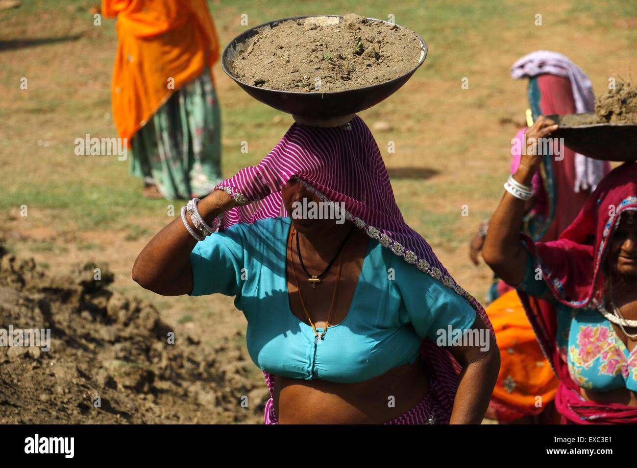 Villagers work on a NREGA (National Rural Employment Guarantee Act