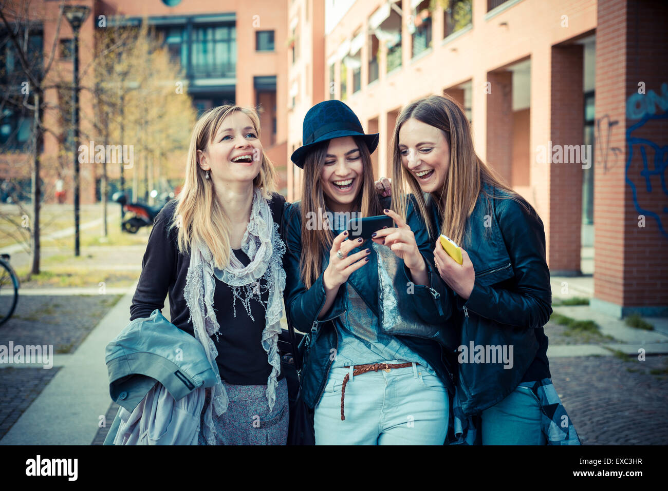Authentic Friends three beautiful friends authentic in urban contest Stock Photo - Alamy