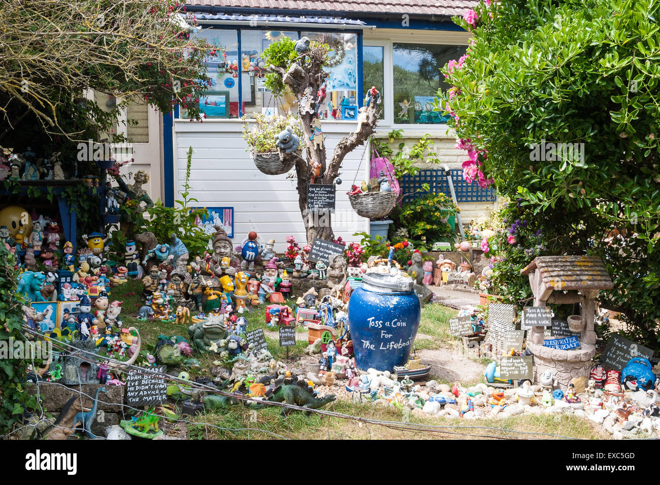 Garden of toys, dolls, figures, etc. Alum Bay, The Isle of Wight, UK