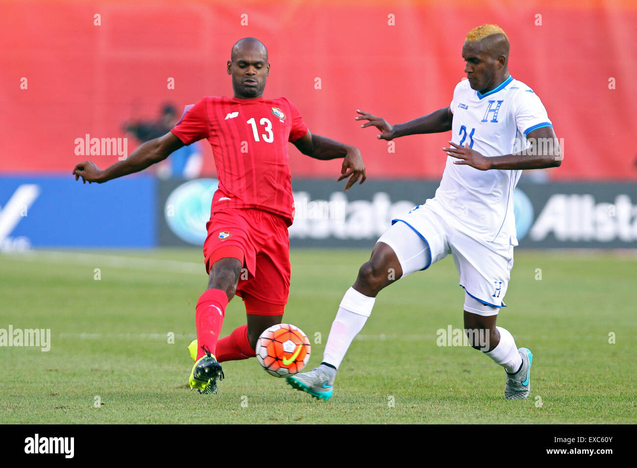 July 10, 2015; Foxborough, MA, USA; Panama defender Adolfo Machado (13) and Honduras defender Brayan Beckeles (21) in action during the CONCACAF Gold Cup match between Panama and Honduras at Gillette Stadium. The match ended in a 1-1 tie. Anthony Nesmith/Cal Sport Media Stock Photo