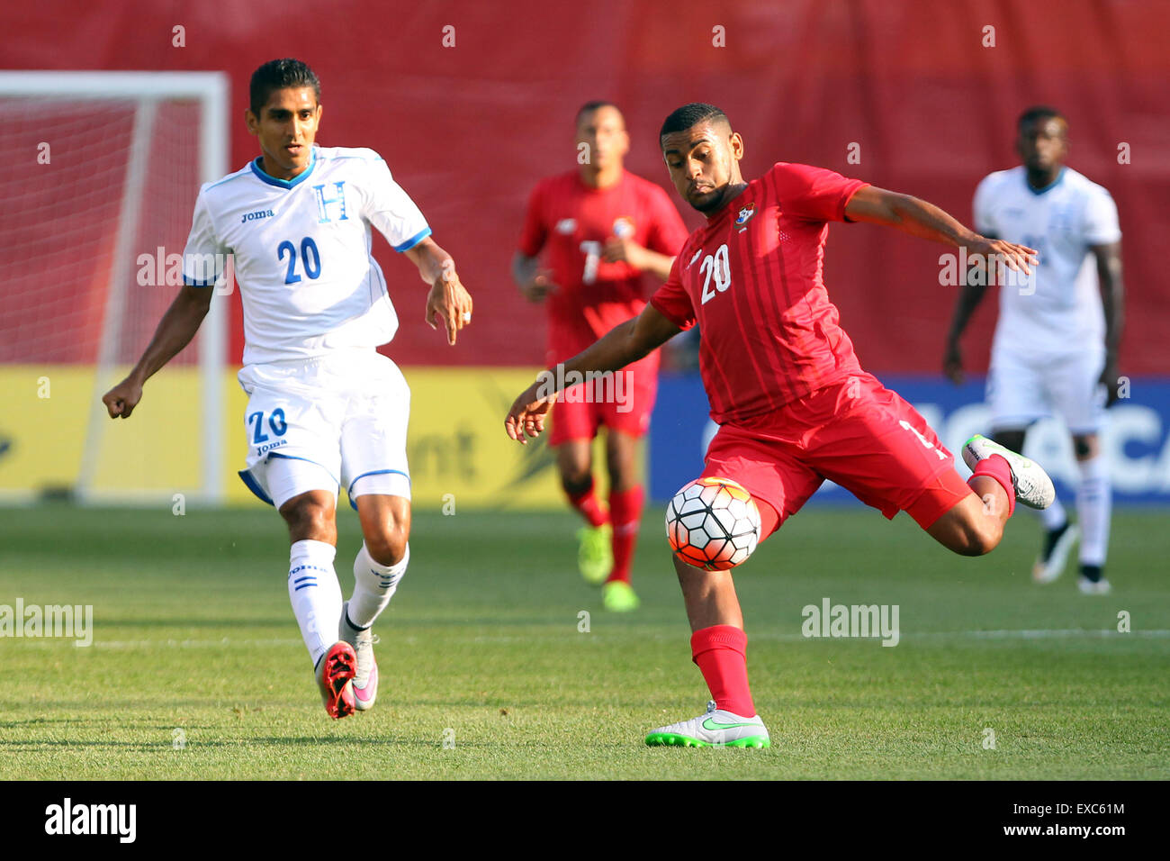 July 10, 2015; Foxborough, MA, USA; Panama midfielder Anibal Godoy (20) and Honduras midfielder Jorge Claros (20) in action during the first half of the CONCACAF Gold Cup match between Panama and Honduras at Gillette Stadium. The match ended in a 1-1 tie. Anthony Nesmith/Cal Sport Media Stock Photo