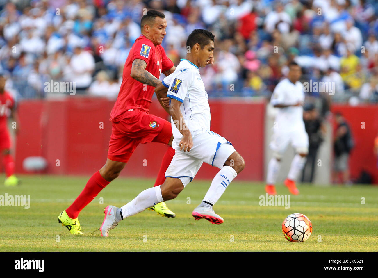 July 10, 2015; Foxborough, MA, USA; Panama forward Blas Perez (7) and Honduras midfielder Jorge Claros (20) in action during the CONCACAF Gold Cup match between Panama and Honduras at Gillette Stadium. The match ended in a 1-1 tie. Anthony Nesmith/Cal Sport Media Stock Photo
