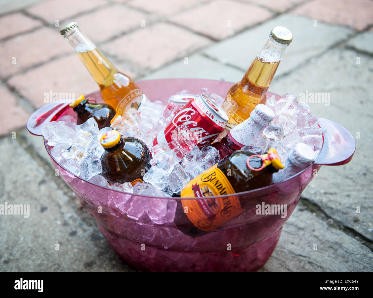 Variety of summer drinks cooling in an ice bucket Stock Photo