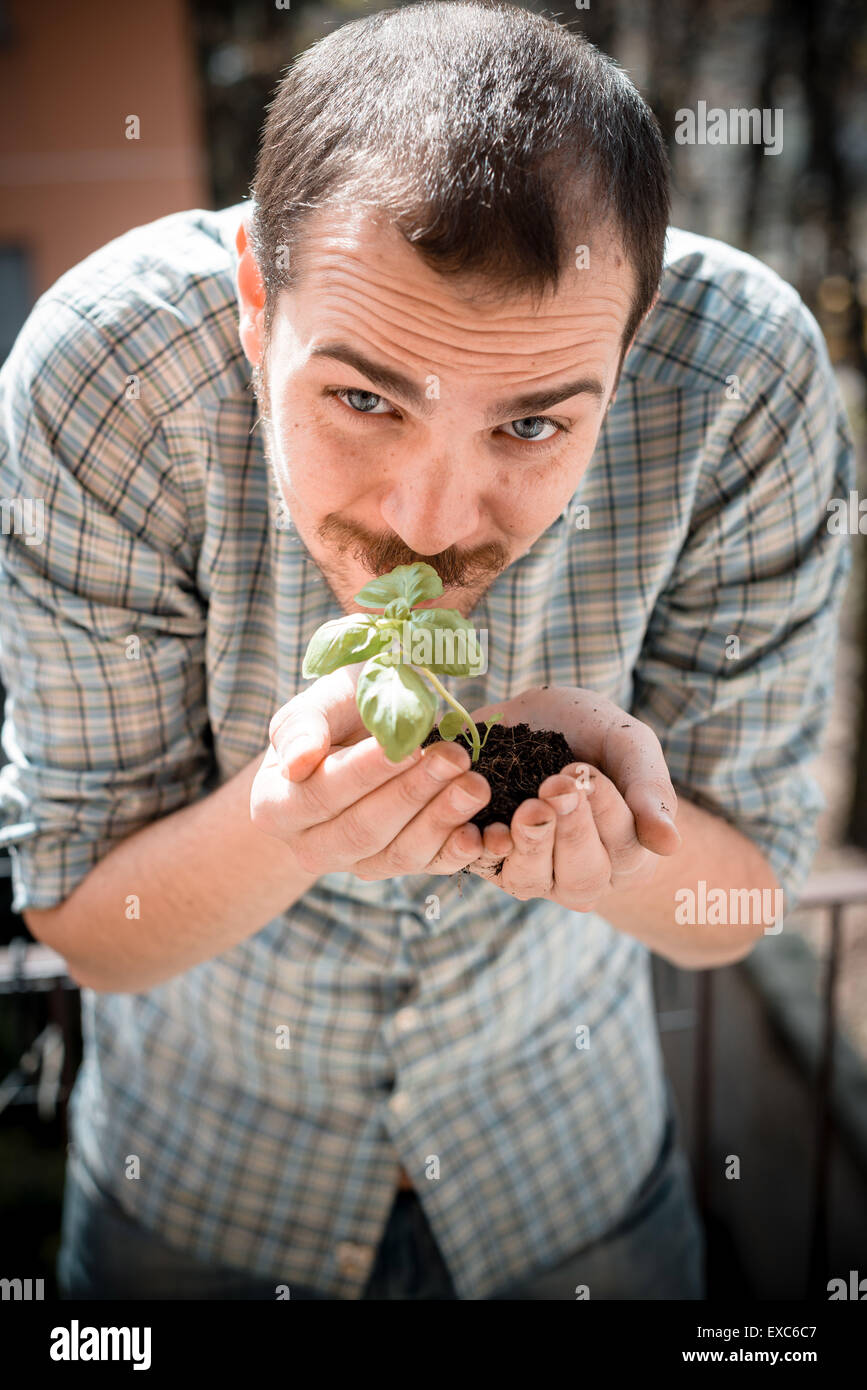 handsome stylish man gardening at home Stock Photo - Alamy