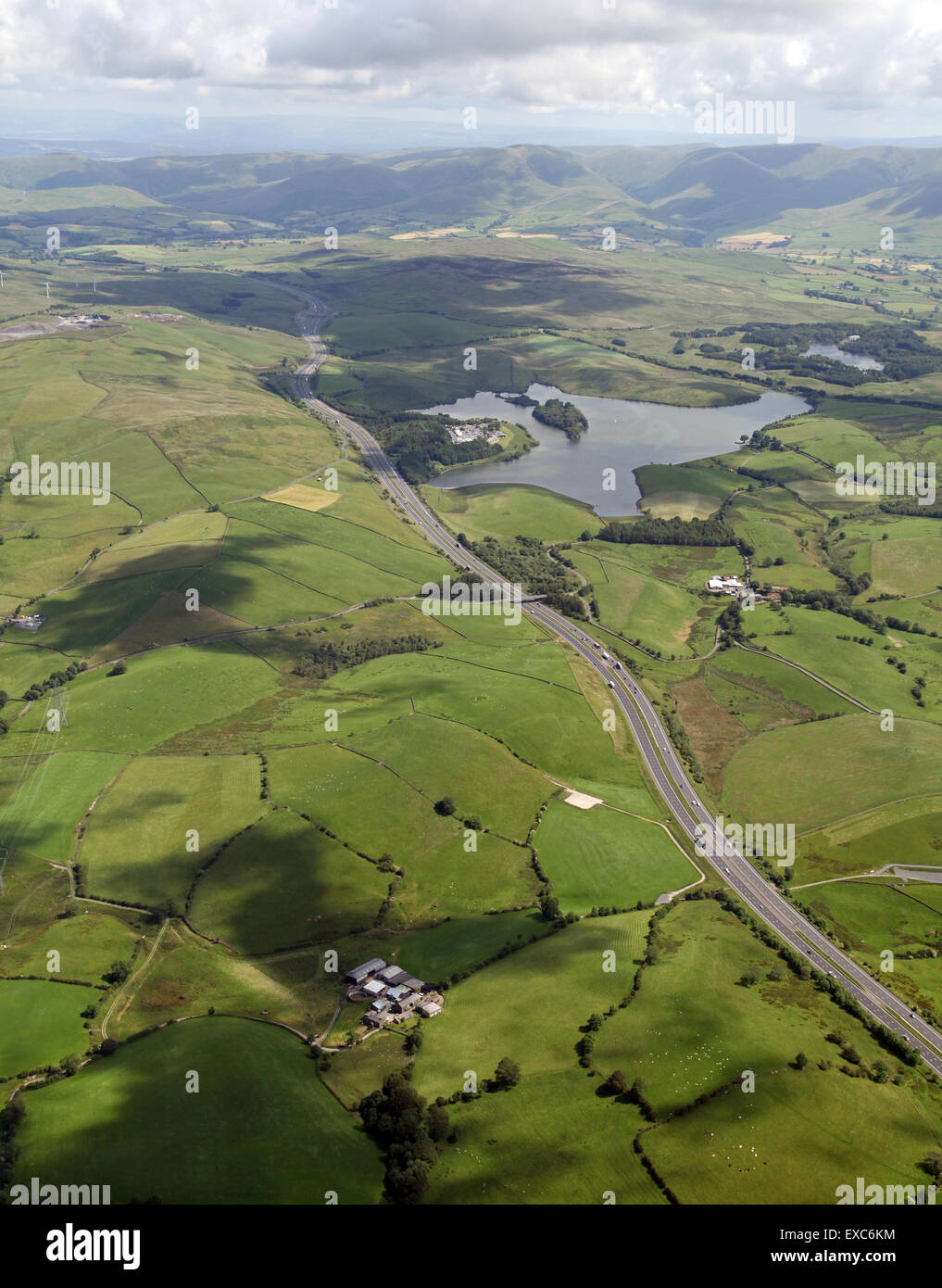 aerial view of the M6 motorway & Killington Lake, as it heads north through Cumbria, UK Stock Photo