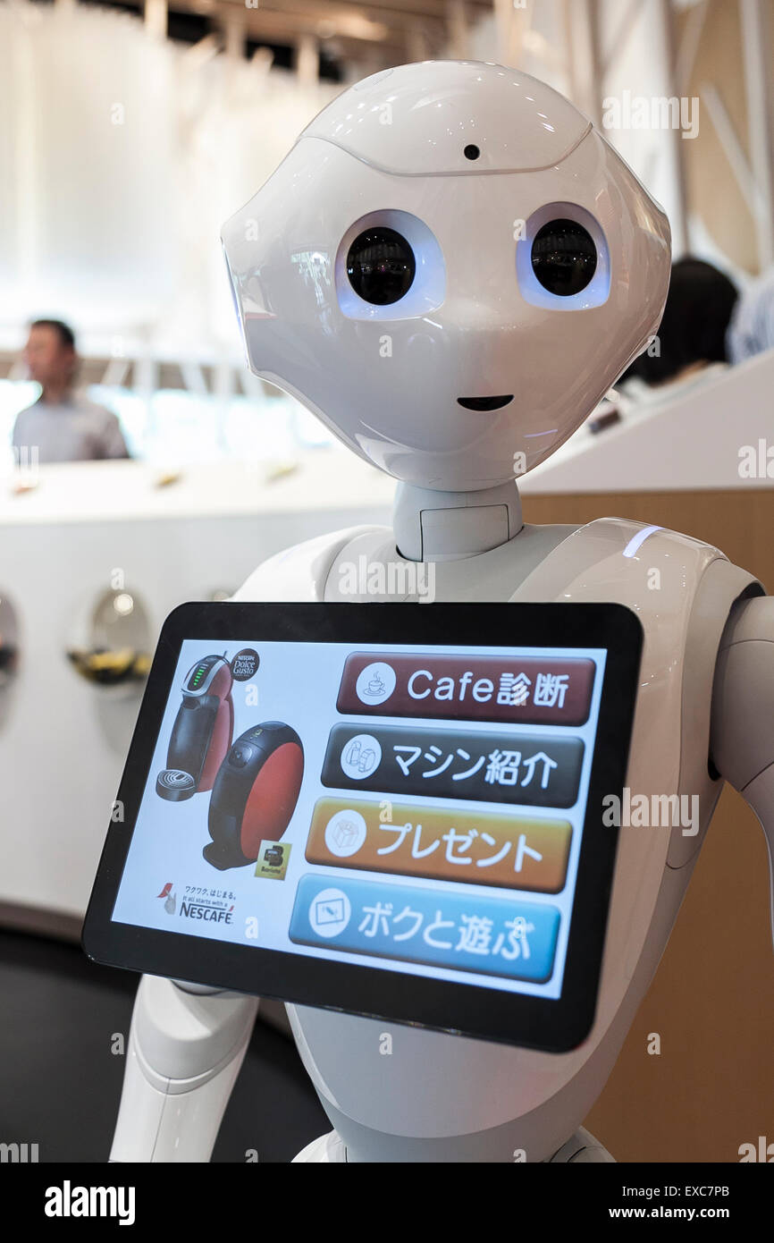 Tokyo, Japan. 11th July, 2015. The humanoid robot Pepper debuted as a new member of staff at the NESCAFE coffee-shop in Harajuku on July 11, 2015, Tokyo, Japan. Six robots are programmed to interact with people while introducing the Nescafe products during a special event ''The world? Future cafe by NESCAFE with Pepper'' on Saturday July 11th. The store will continue to employ two robots as regular staff to introduce the shop's products and services. Credit:  Rodrigo Reyes Marin/AFLO/Alamy Live News Stock Photo