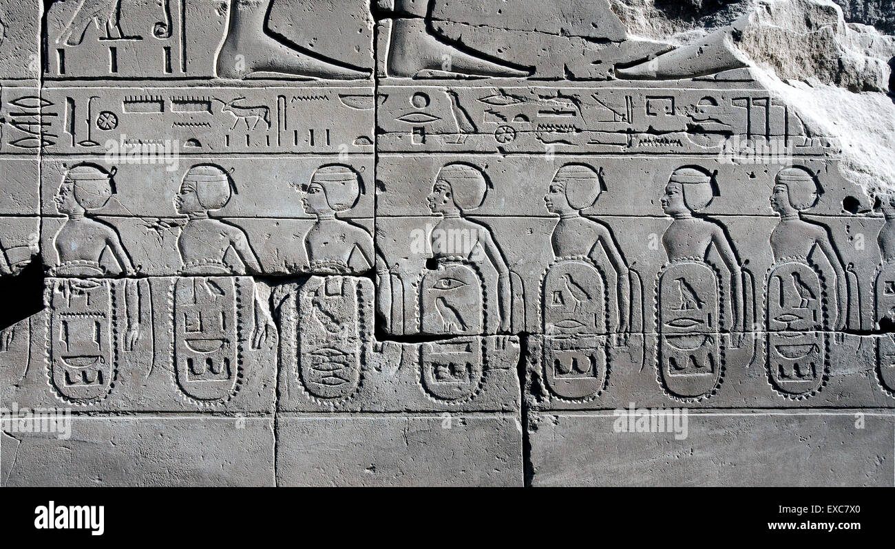 Karnak, Luxor, Egypt. Temple of Karnak sacred to god Amon: the won cities from Tuthmosis III carved in a wall Stock Photo