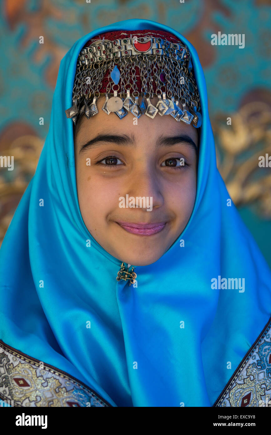 Girl Pausing In Traditional Clothing For A Photo Souvenir In The Saadabad Palace, Shemiranat County, Tehran, Iran Stock Photo