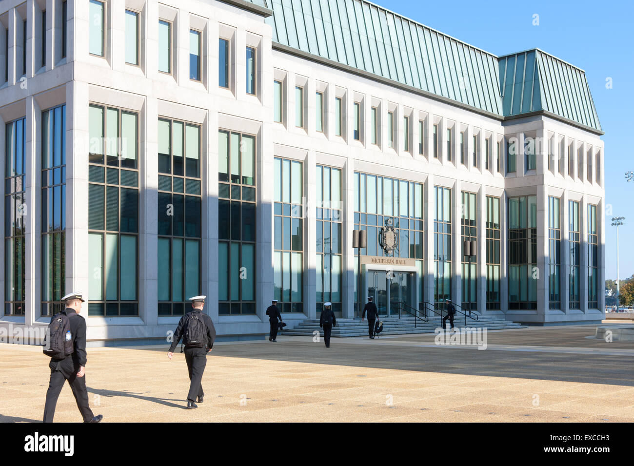 Midshipmen walk to class in Michelson Hall at the US Naval Academy in Annapolis, Maryland. Stock Photo