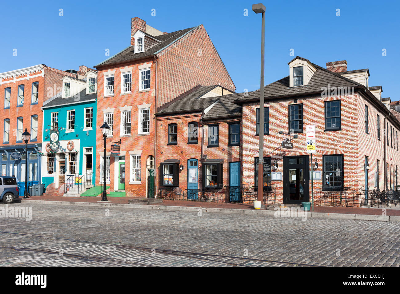 Mixed-use buildings on Thames Street in the historic Fell's Point neighborhood in Baltimore, Maryland. Stock Photo